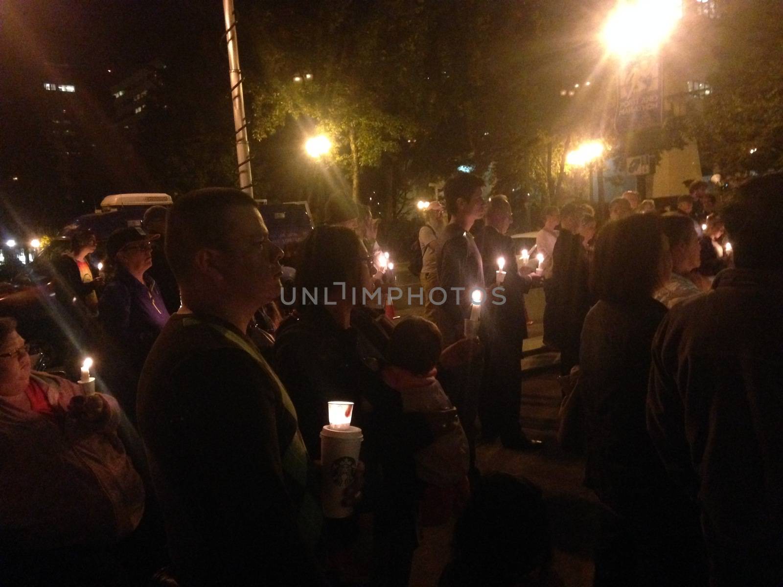 US, Portland: Religious leaders, police and locals attended a vigil outside Portland City Hall on September 1, 2015, following a mass shooting at Umpqua Community College, Roseburg. 13 people are now confirmed to have been shot dead at the college. Members of the Oregon Symphony also played at the vigil.