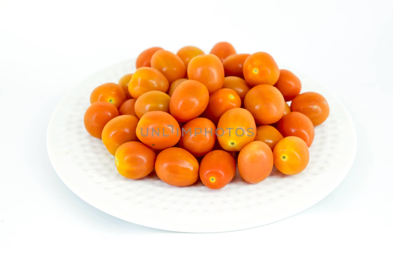 Cherry tomatoes in white plate by art9858