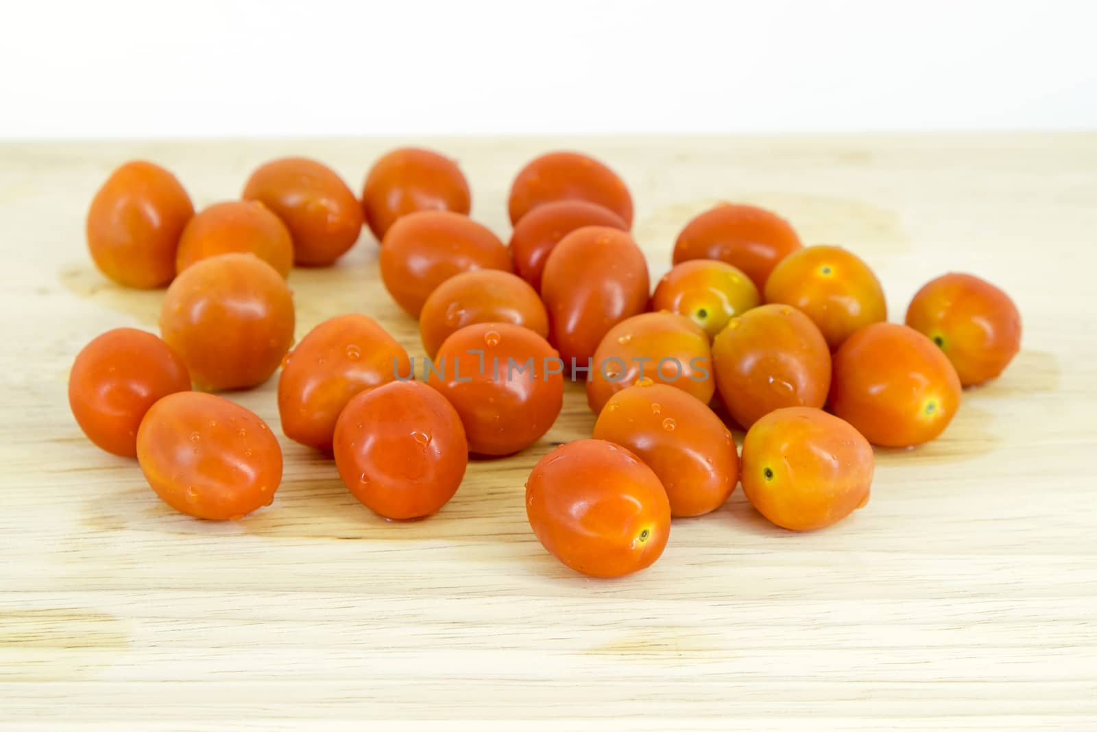 Cherry tomatoes on cutting board by art9858
