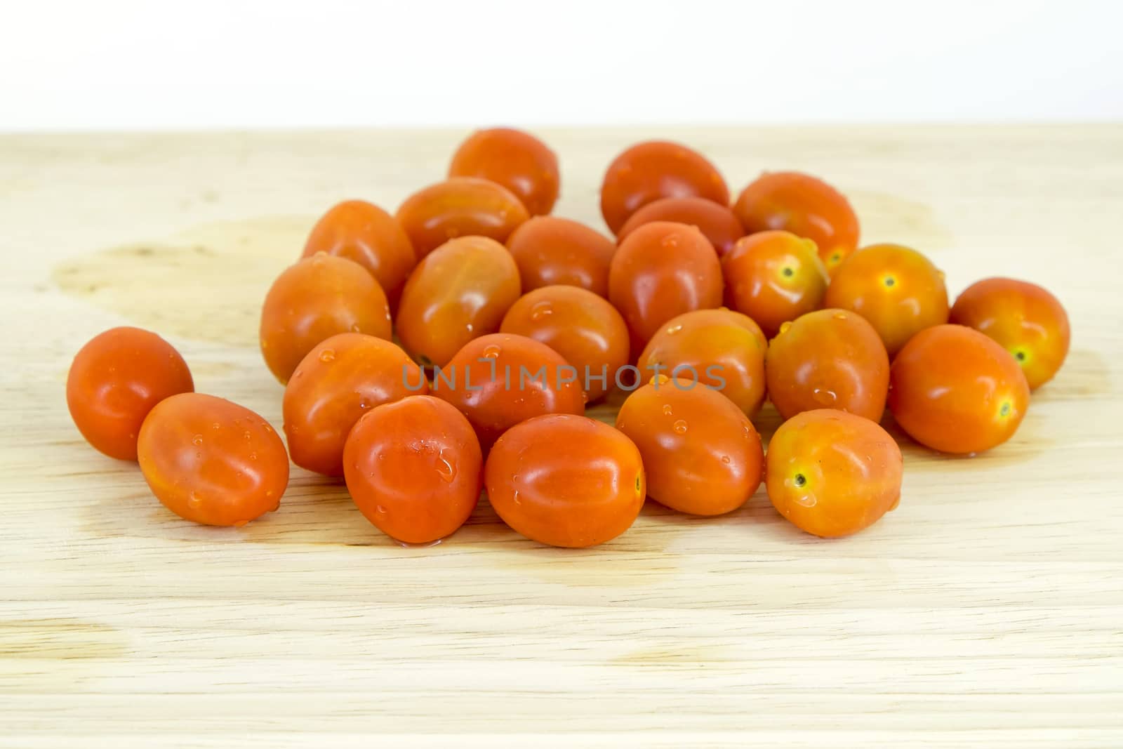 Cherry tomatoes on cutting board by art9858