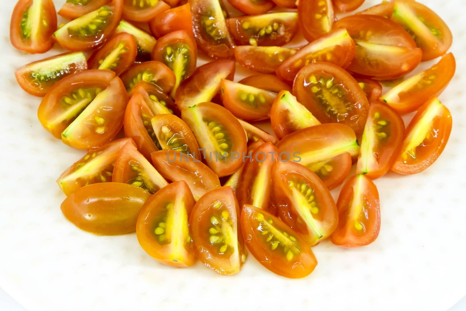 slices of cherry  tomatoes isolate on white background