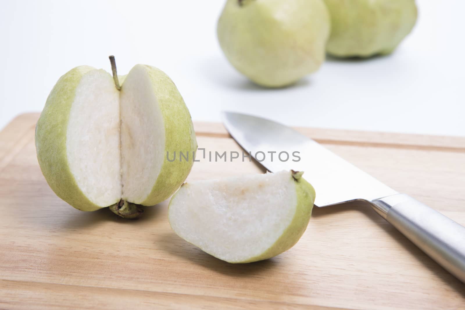 Fresh guava with knife isolated
