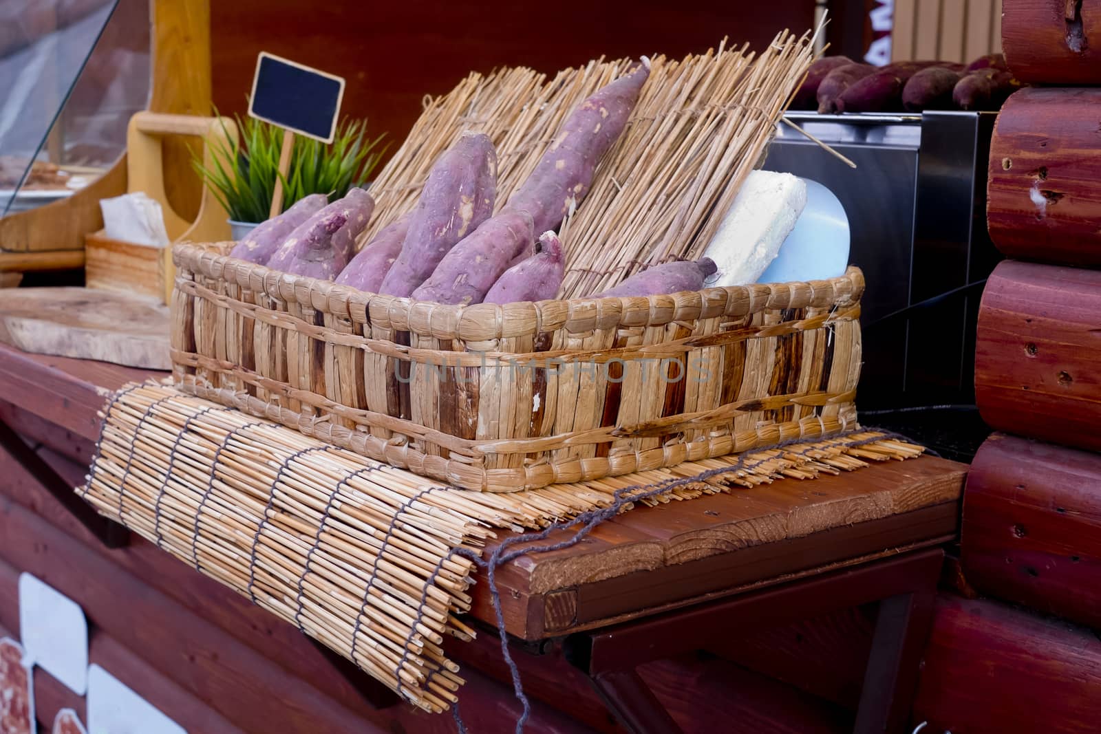 Sweet potato with wood skewer ready to roasted