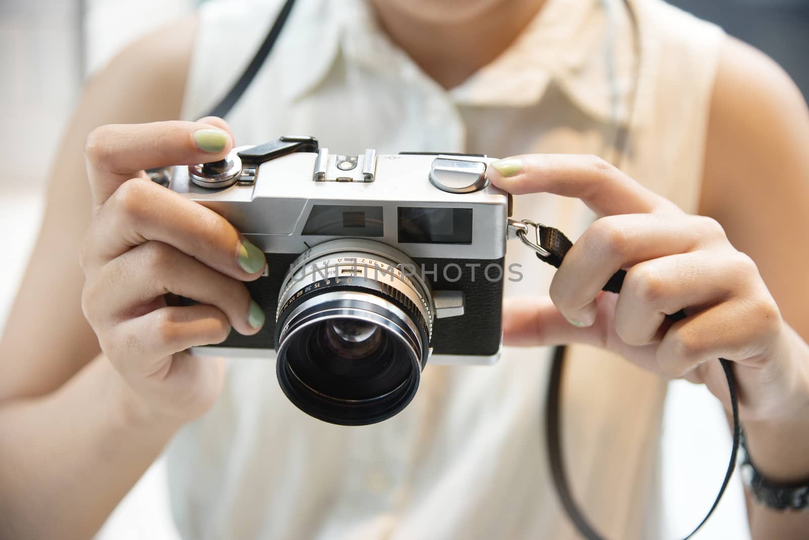 Hipster girl take a photo with vintage camera by pixbox77