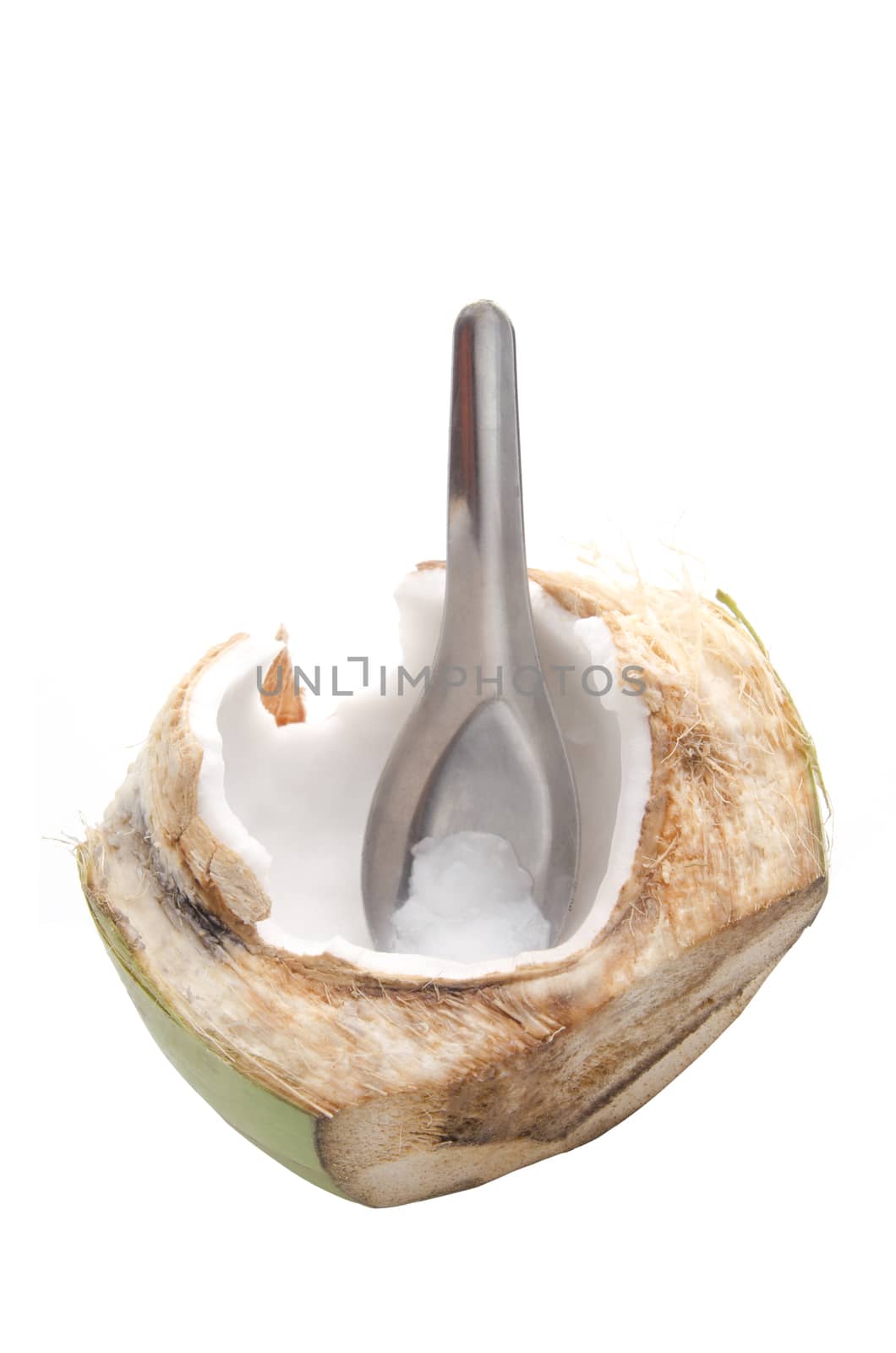 Half green coconut with spoon ready to eat isolated on white