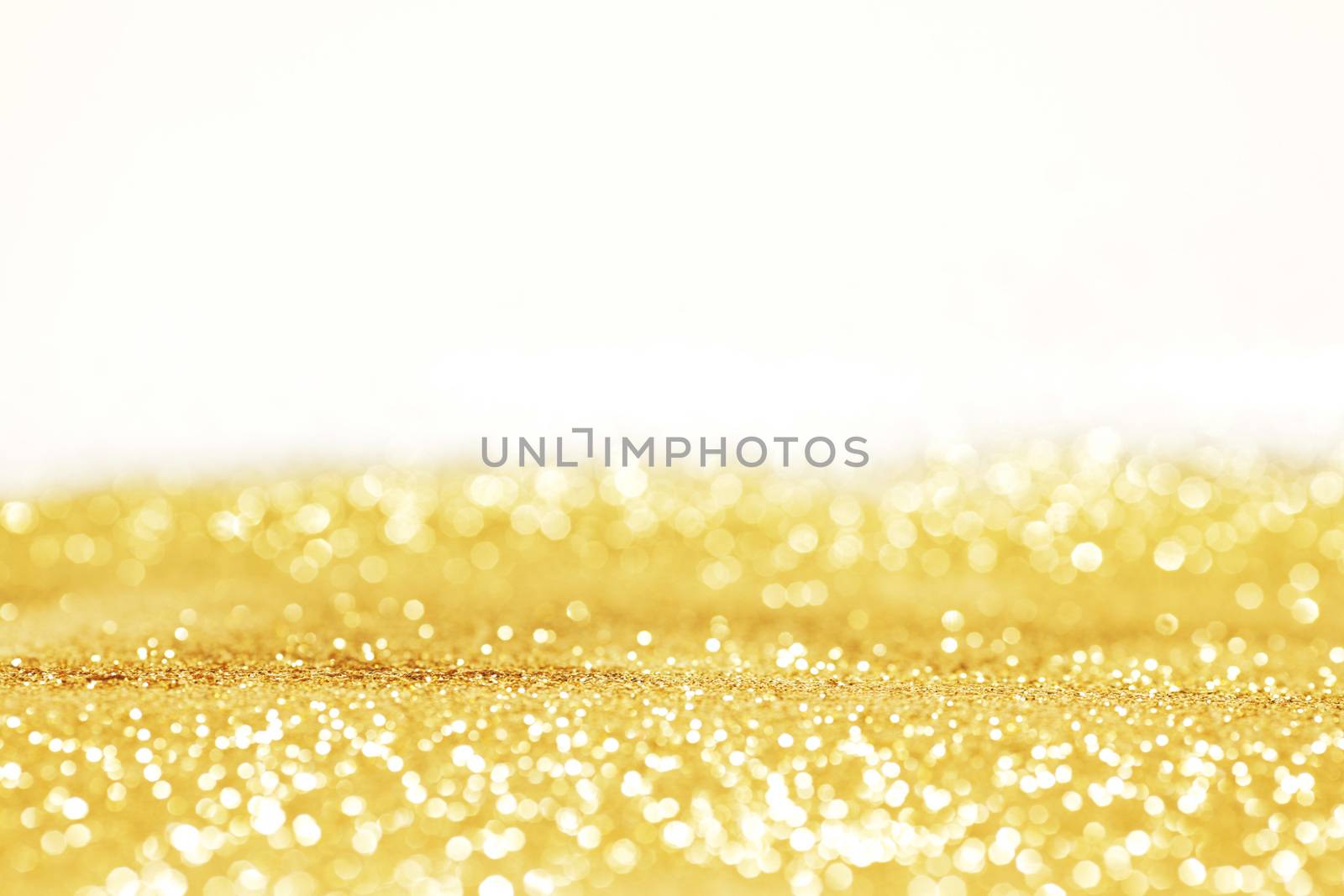 Abstract glitter bokeh holiday golden background