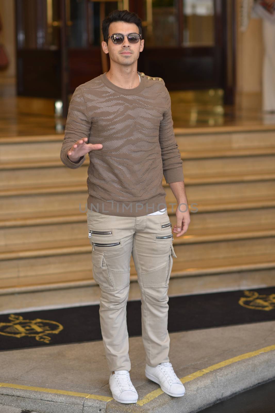 FRANCE, Paris : Famous singer Joe Jonas enters InterContinental hotel in Paris on October 1st, 2015 for Paris Fashion week. 