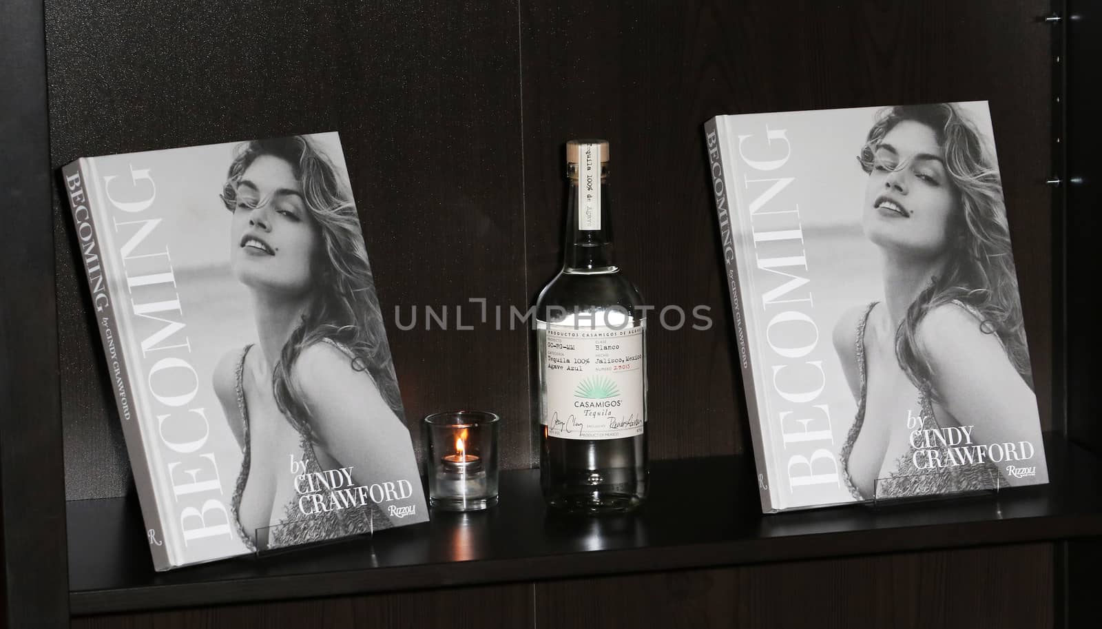 UNITED KINGDOM, London: Cindy Crawford's new book Becoming and bottles of George Clooney's new tequila Casamigos Tequila are displayed at a joint launch at the Beaumont Hotel in central London on October 1, 2015. 