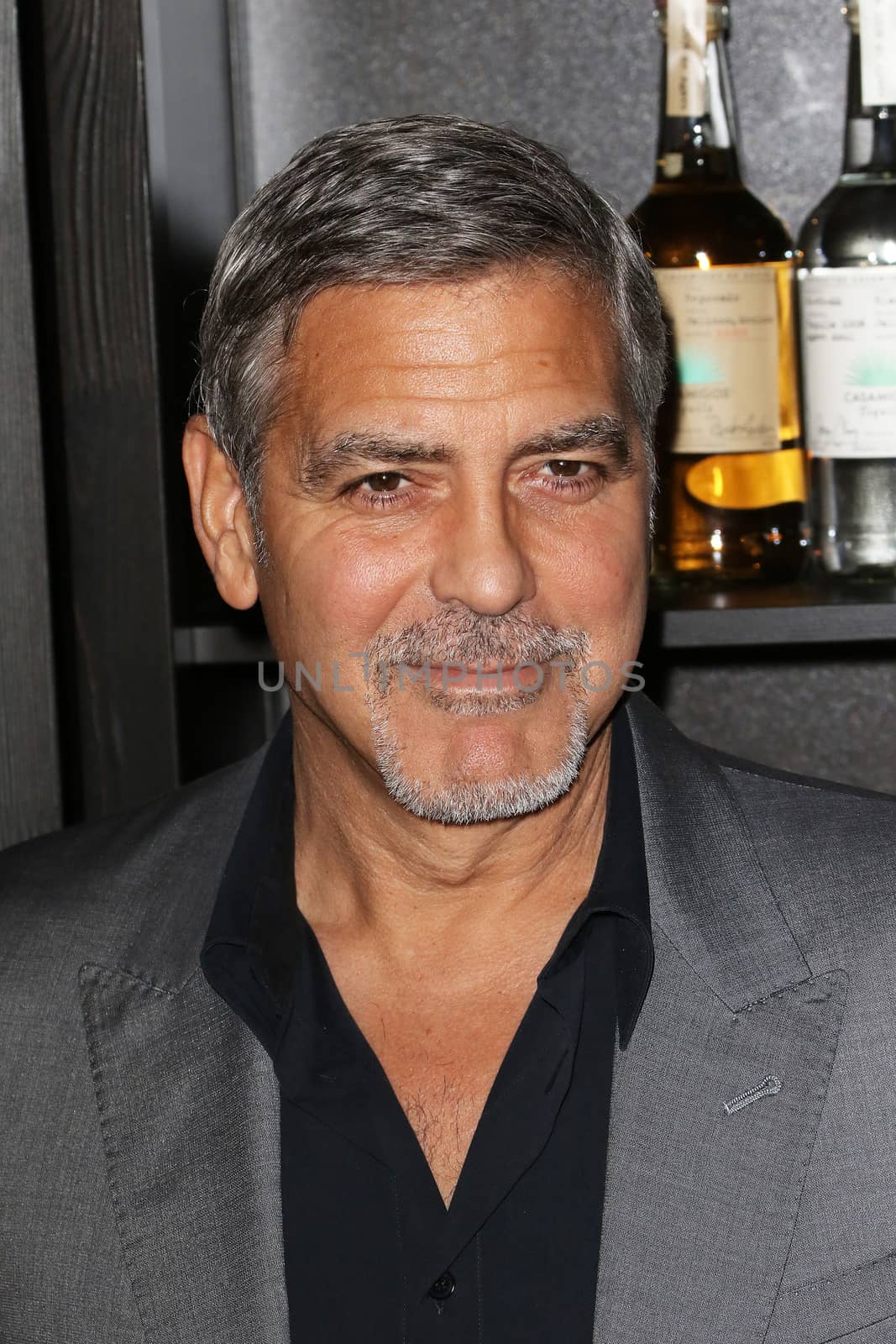 UNITED KINGDOM, London: George Clooney attends the joint launch of Clooney's new tequila label, Casamigos Tequila, and Cindy Crawford's new book Becoming at the Beaumont Hotel in central London on October 1, 2015. 