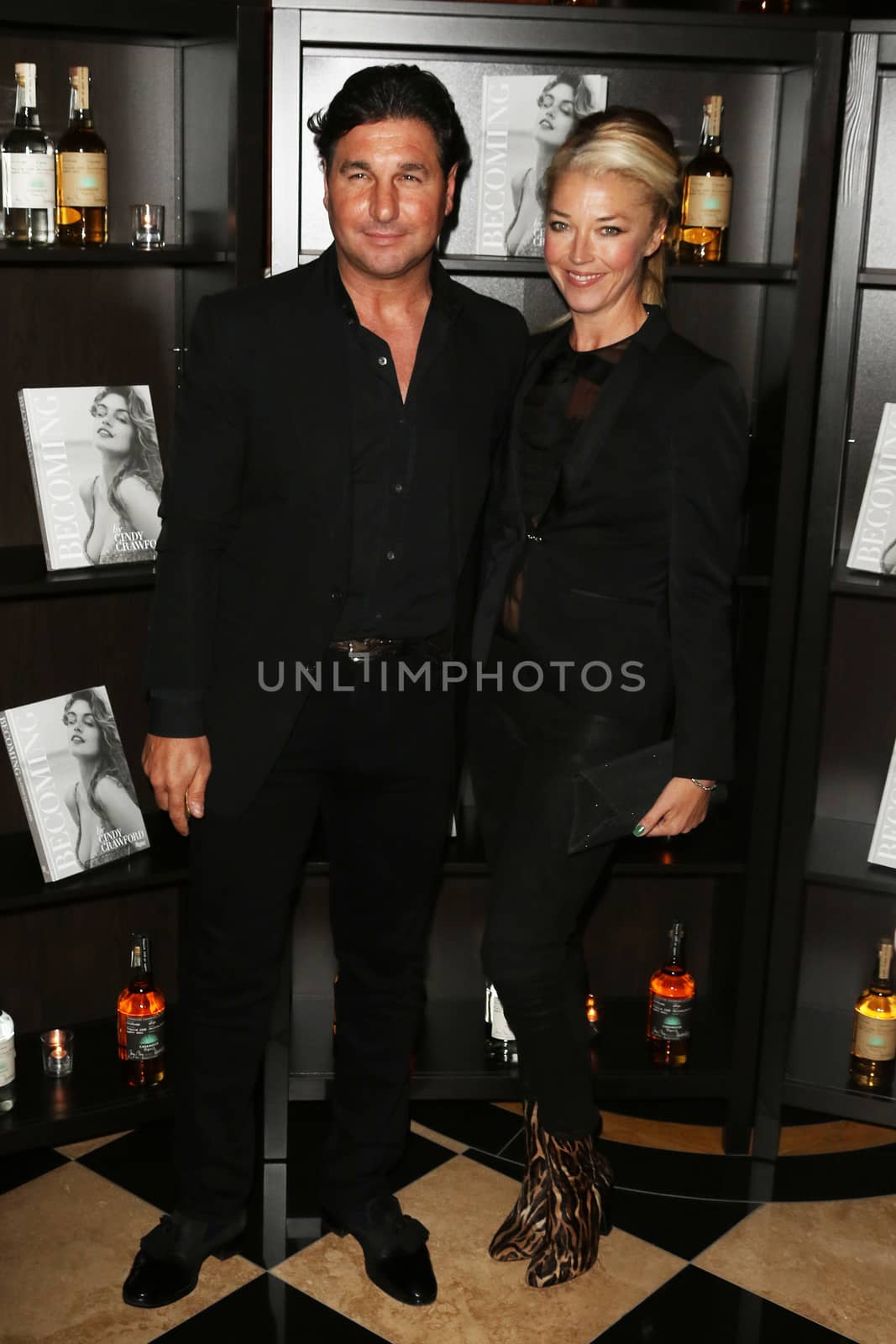 UNITED KINGDOM, London: Giorgio Veroni and Tamara Beckwith attend the joint launch of George Clooney's new tequila label, Casamigos Tequila, and Cindy Crawford's new book Becoming at the Beaumont Hotel in central London on October 1, 2015. 