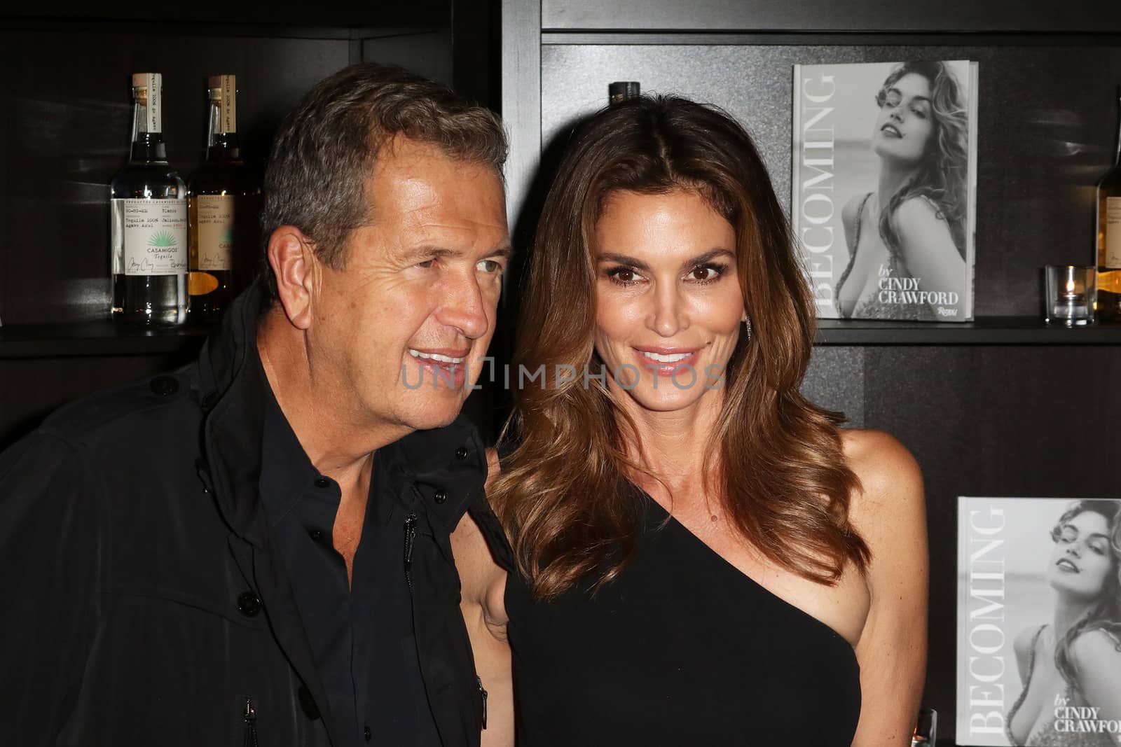 UNITED KINGDOM, London: Mario Testino and Cindy Crawford attends the joint launch of George Clooney's new tequila label, Casamigos Tequila, and Crawford's new book Becoming at the Beaumont Hotel in central London on October 1, 2015. 