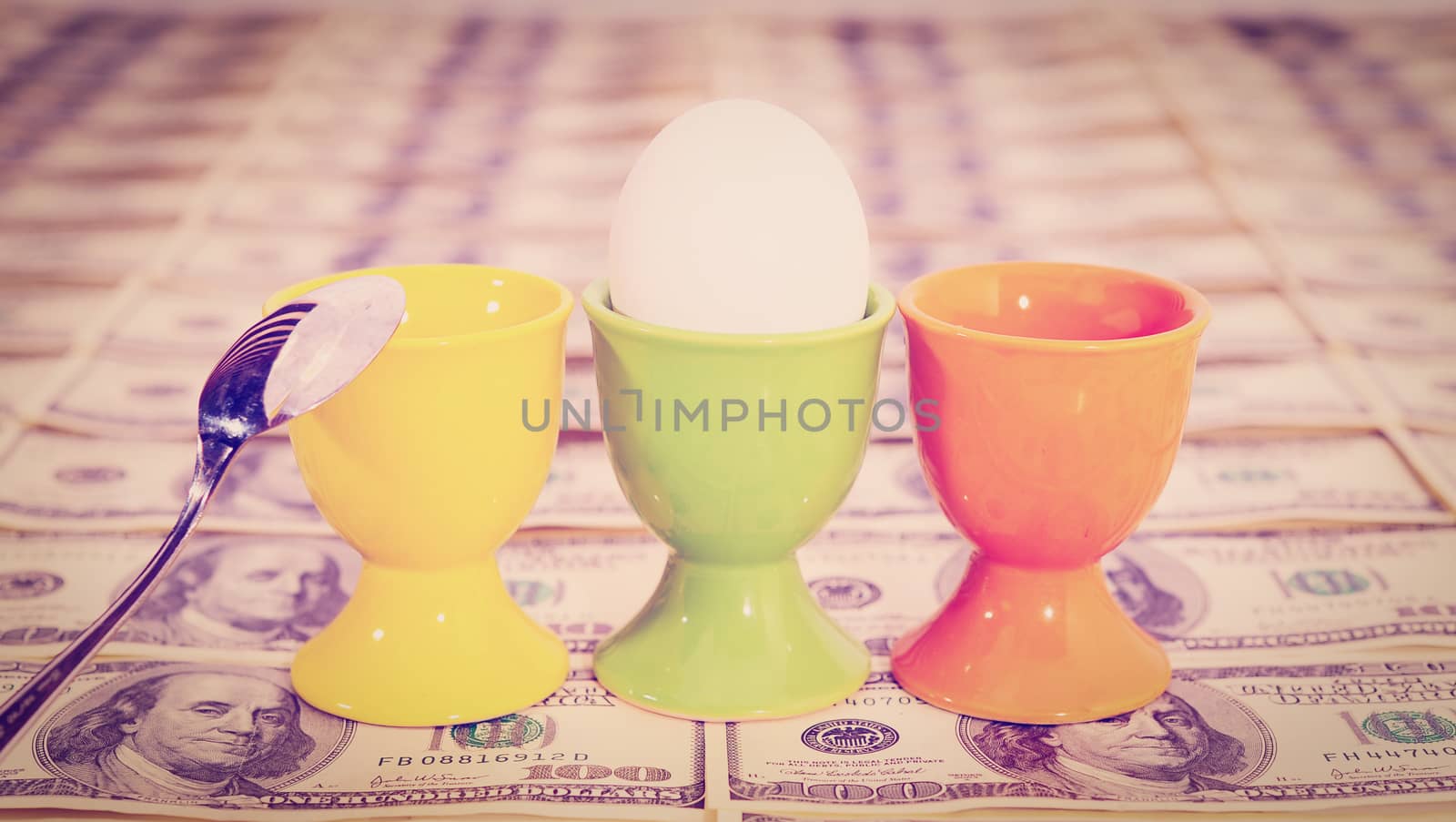 Three Eggs on Background of  Hundred Dollar Bills, Instagram Effect


