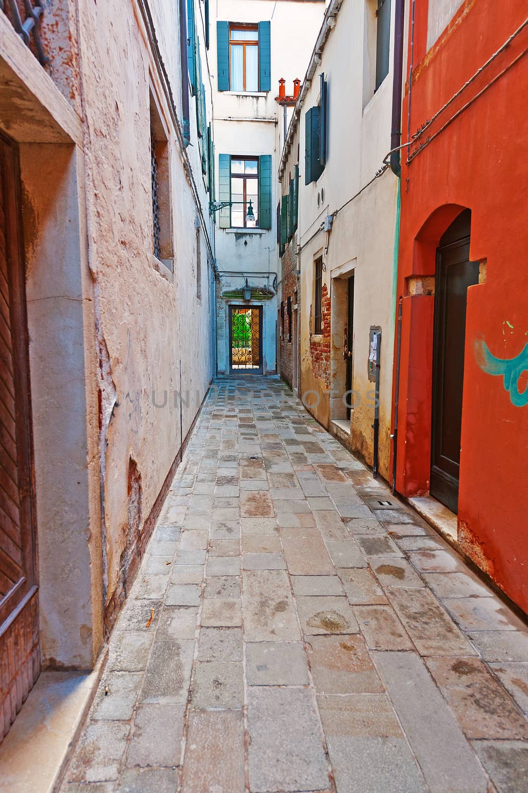 Narrow Alley with Old Buildings in Italian City of Venice
