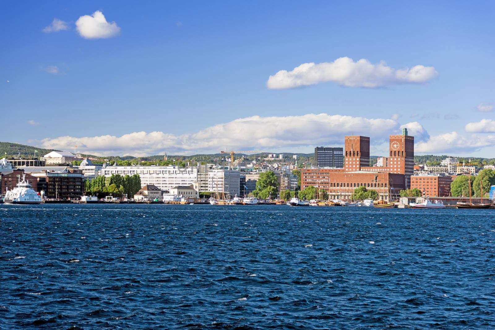 View of Oslo Town Hall  and Aker Brygge from the sea by Nanisimova