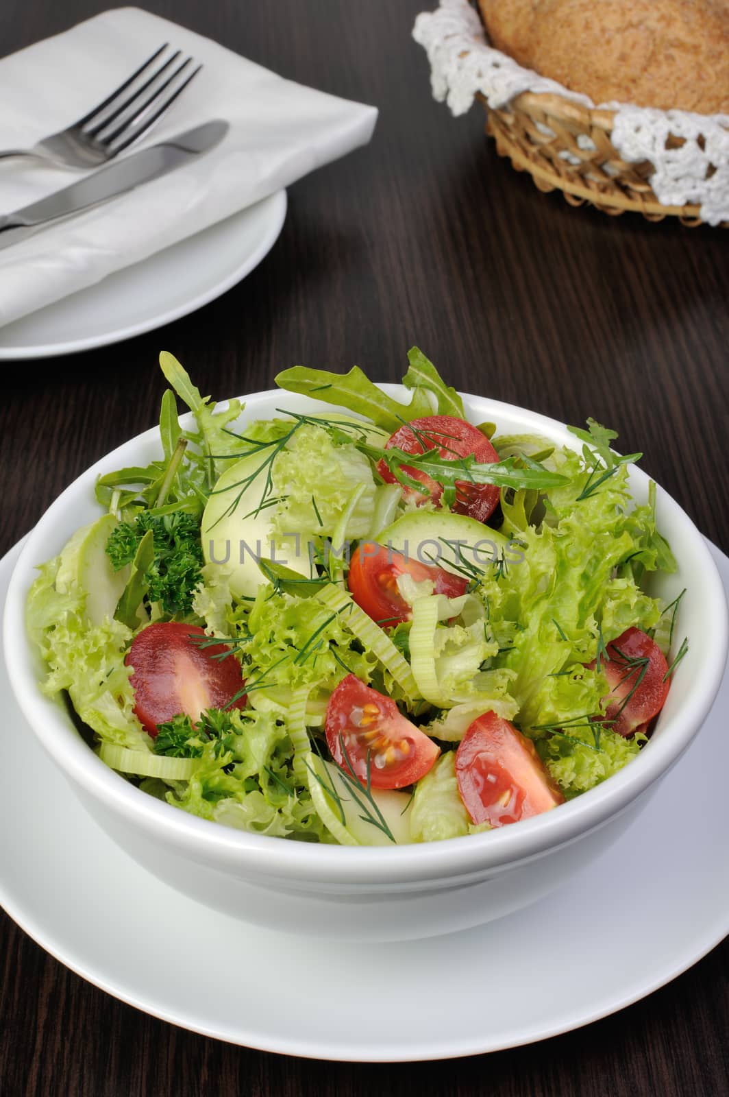 Light summer salad of lettuce with arugula and cherry tomatoes