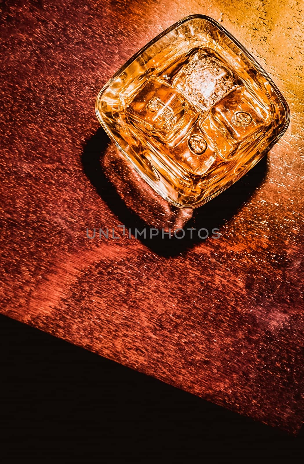 top of view of glass of whiskey on wood table artistic style, warm atmosphere, time of relax with whisky with space for text