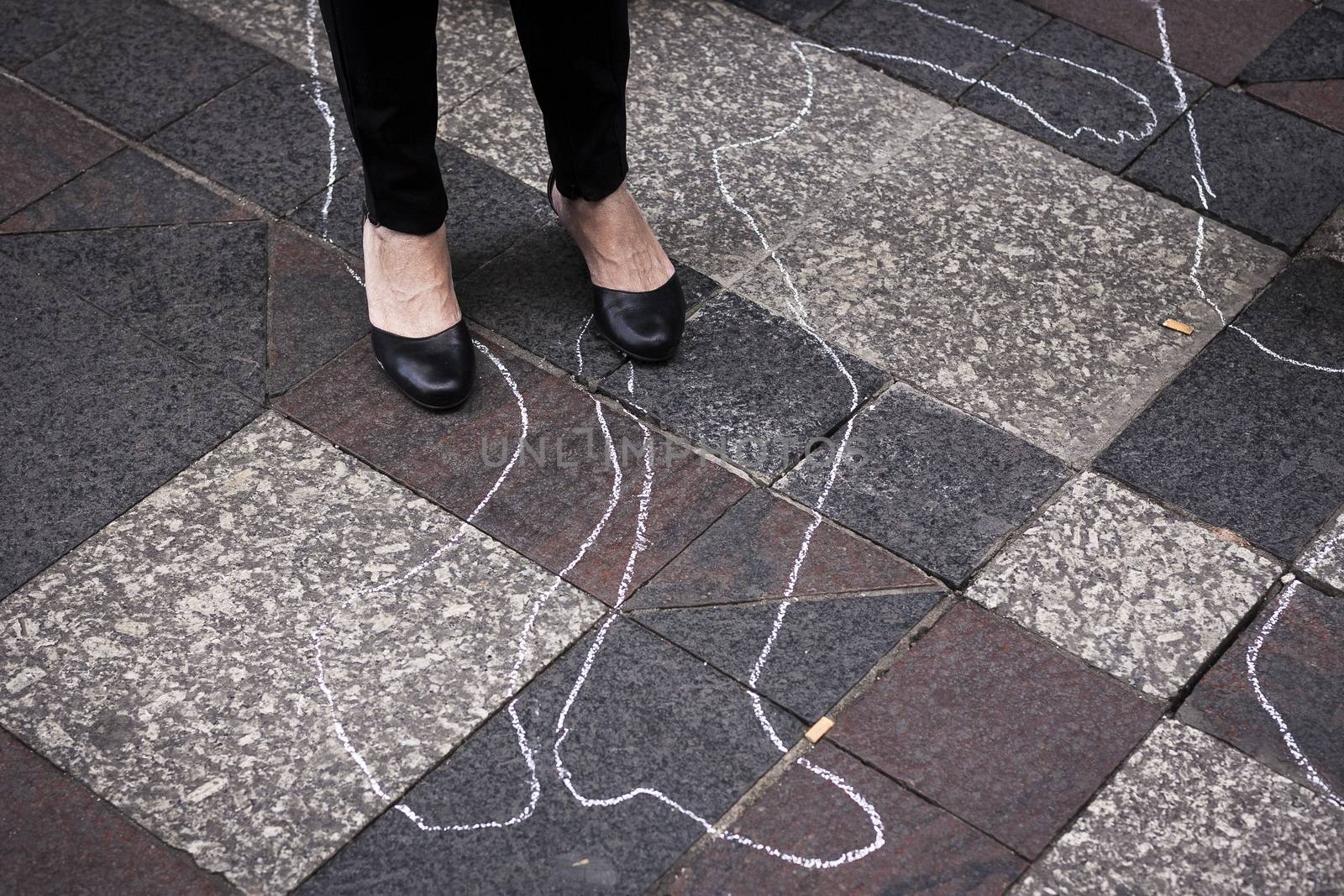 SPAIN, Madrid: Women dressed in all black and feigned their own death in downtown Madrid as part of a performance protest, on October 2, 2015, denouncing gender-based violence. 