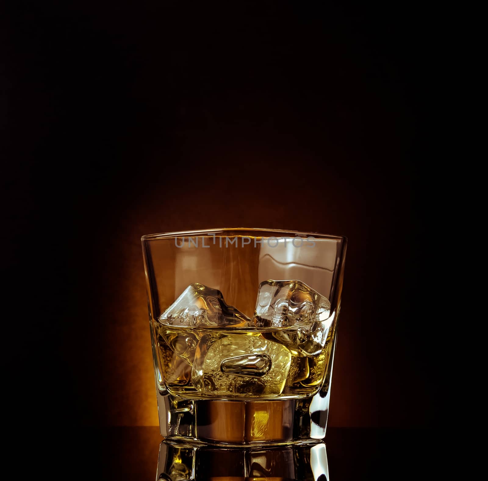 glass of whiskey on black table with reflection, warm atmosphere, time of relax with whisky