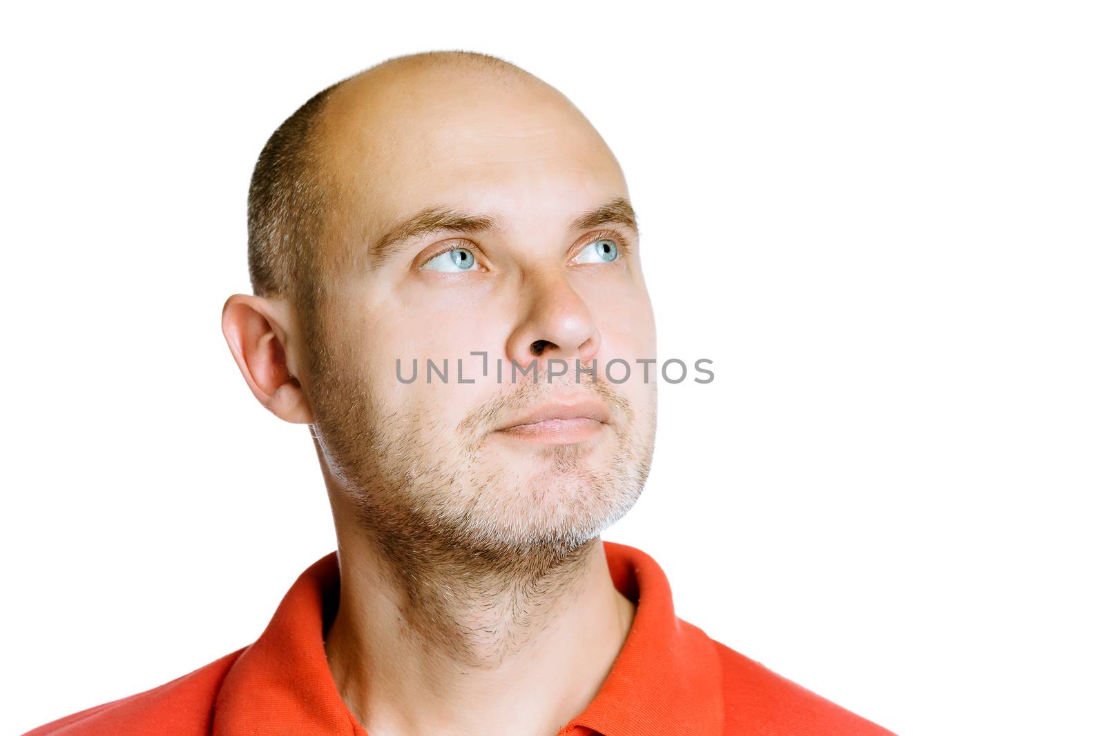 Unshaven man looking up. Isolated on white. Studio