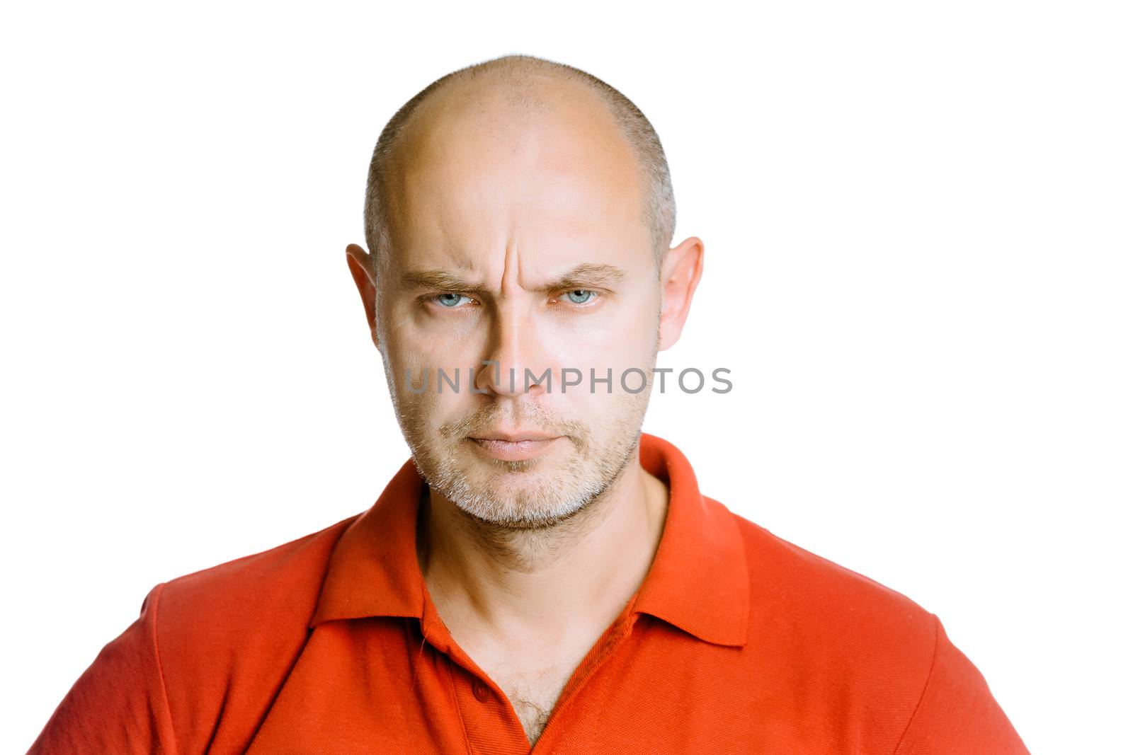 Unshaven man scowling. Isolated on white. Studio