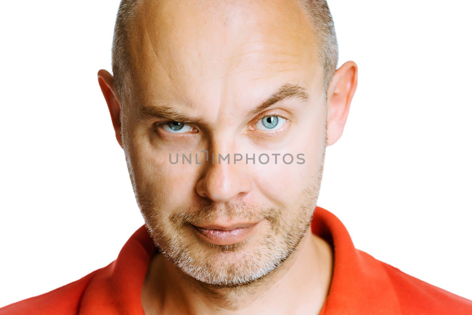 Unshaven man scowling. Isolated on white. Studio