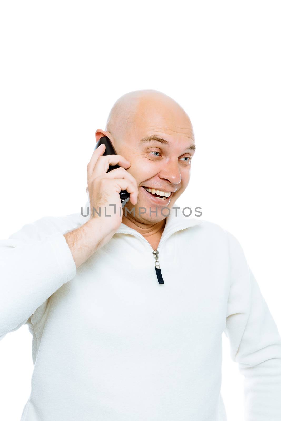 Bald man emotionally communicates by phone. Isolated on white. Studio