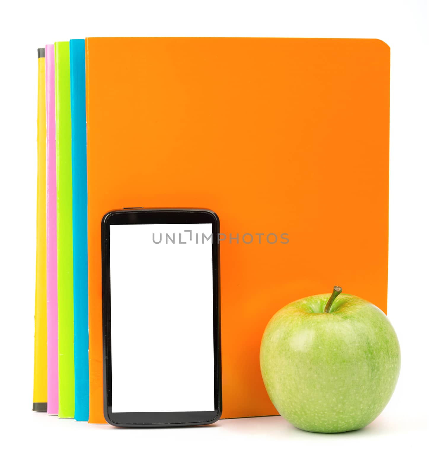 Fresh apple with exercise books and smartphone by cherezoff