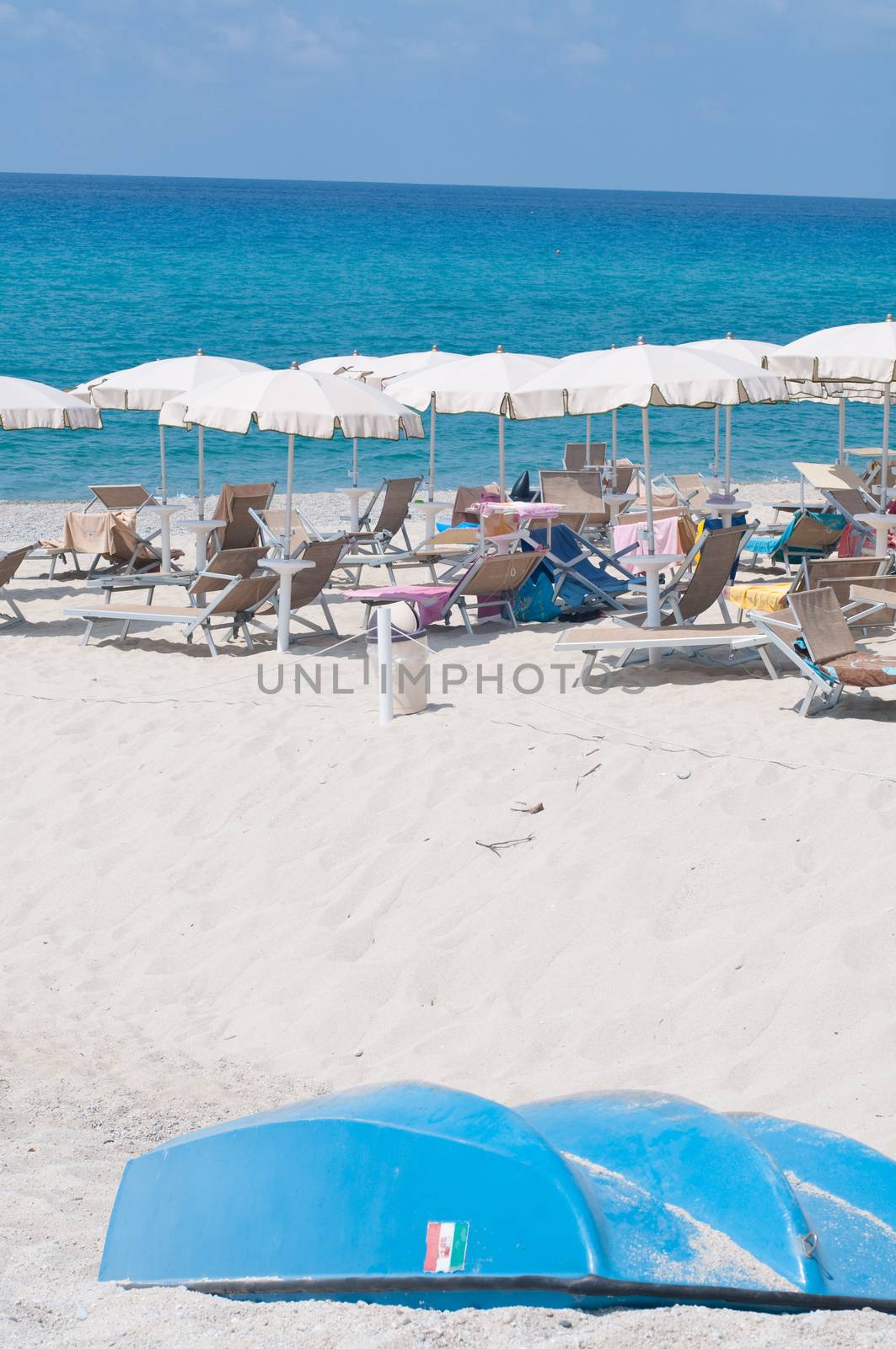 Many umbrellas and chairs at a resort in southern Italy