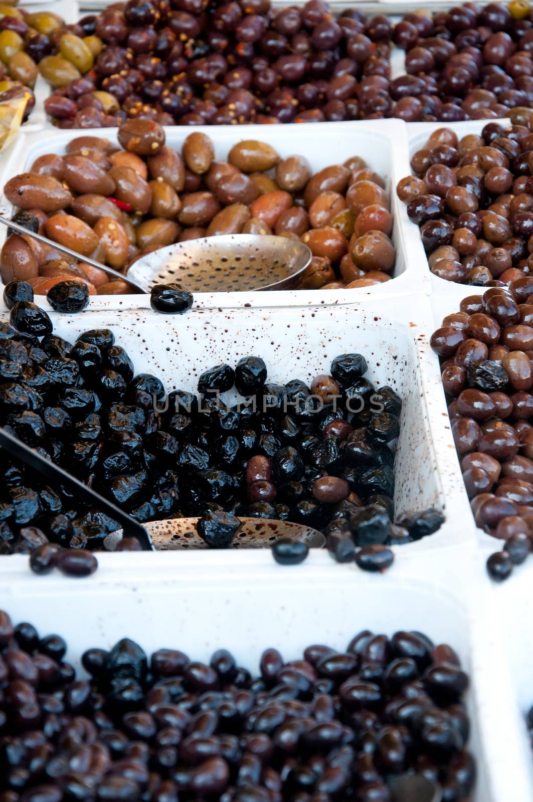 Container containing olives of various colors