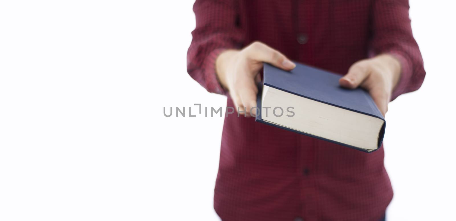 Man holding large closed book with blank cover, isolated on a white background