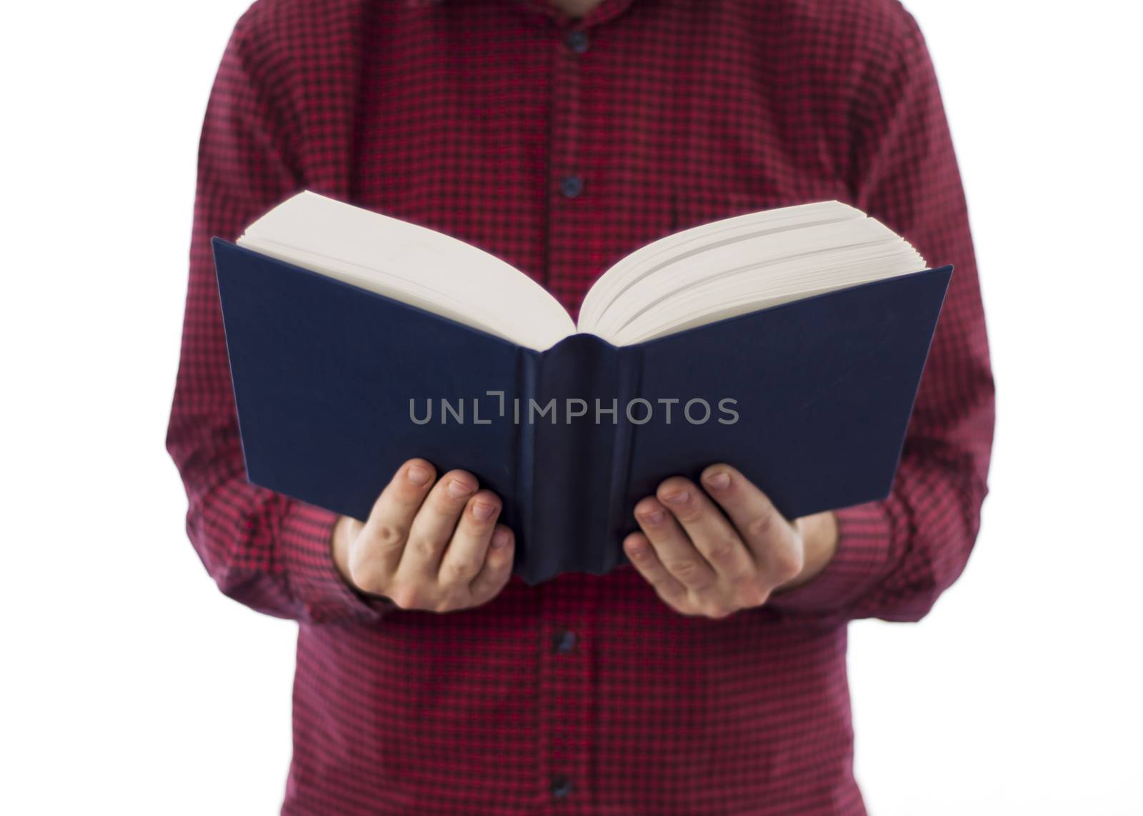Man holding large open book with blank cover, isolated on a white background