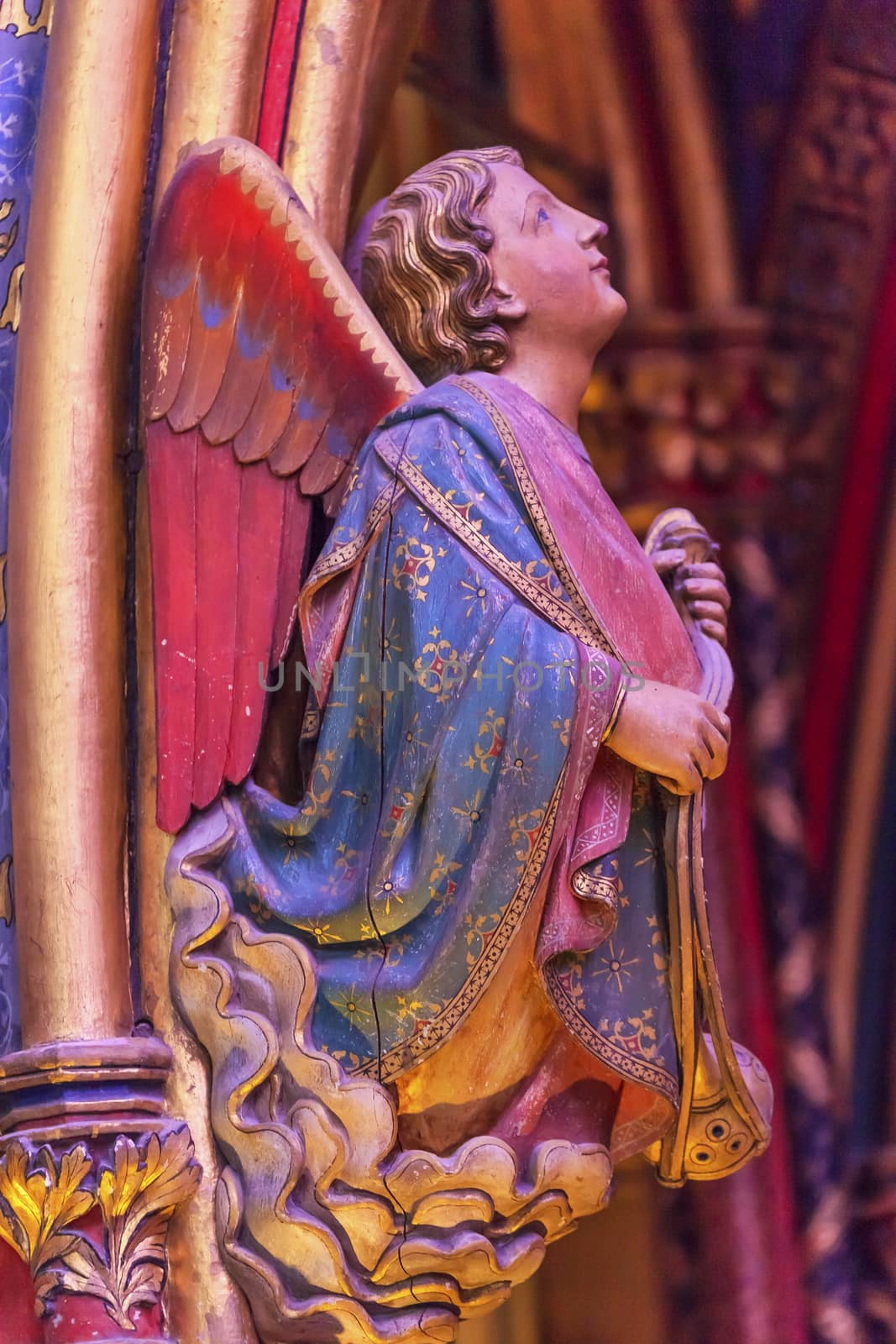 Angel Wood Carving Cathedral Saint Chapelle Paris France.  Saint King Louis 9th created Sainte Chappel in 1248 to house Christian relics, including Christ's Crown of Thorns.  Stained Glass created in the 13th Century and shows various biblical stories along wtih stories from 1200s.