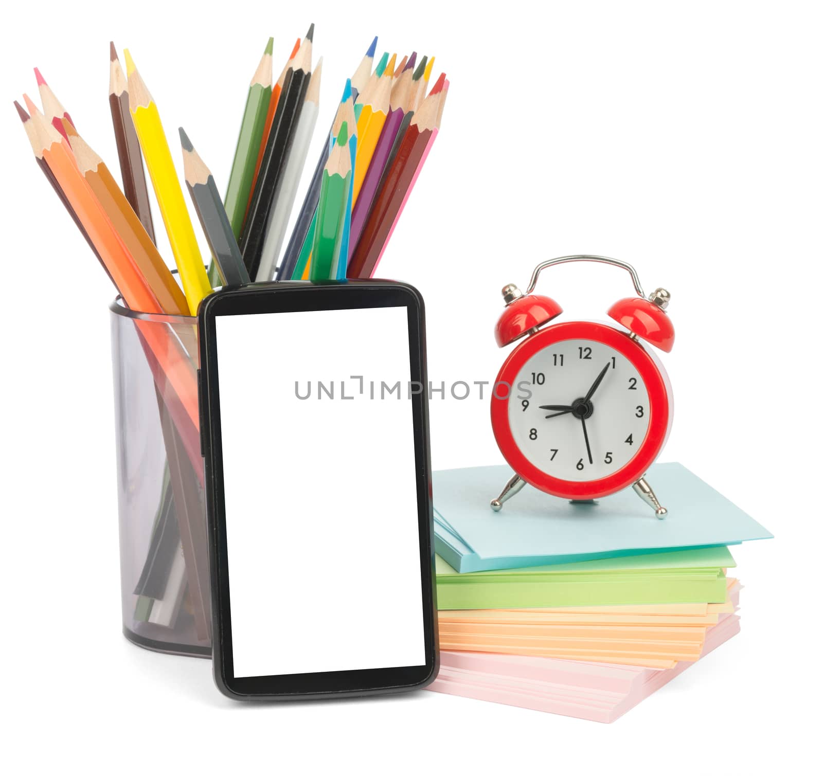 Pencil cup with crayons and alarm clock on isolated white background