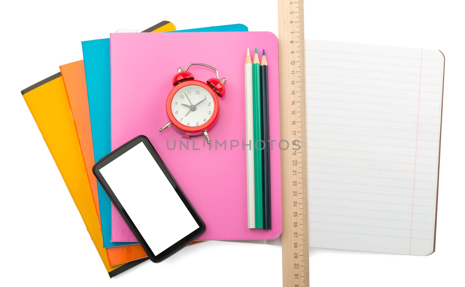 Crayons on copybooks with smartphone on isolated white background
