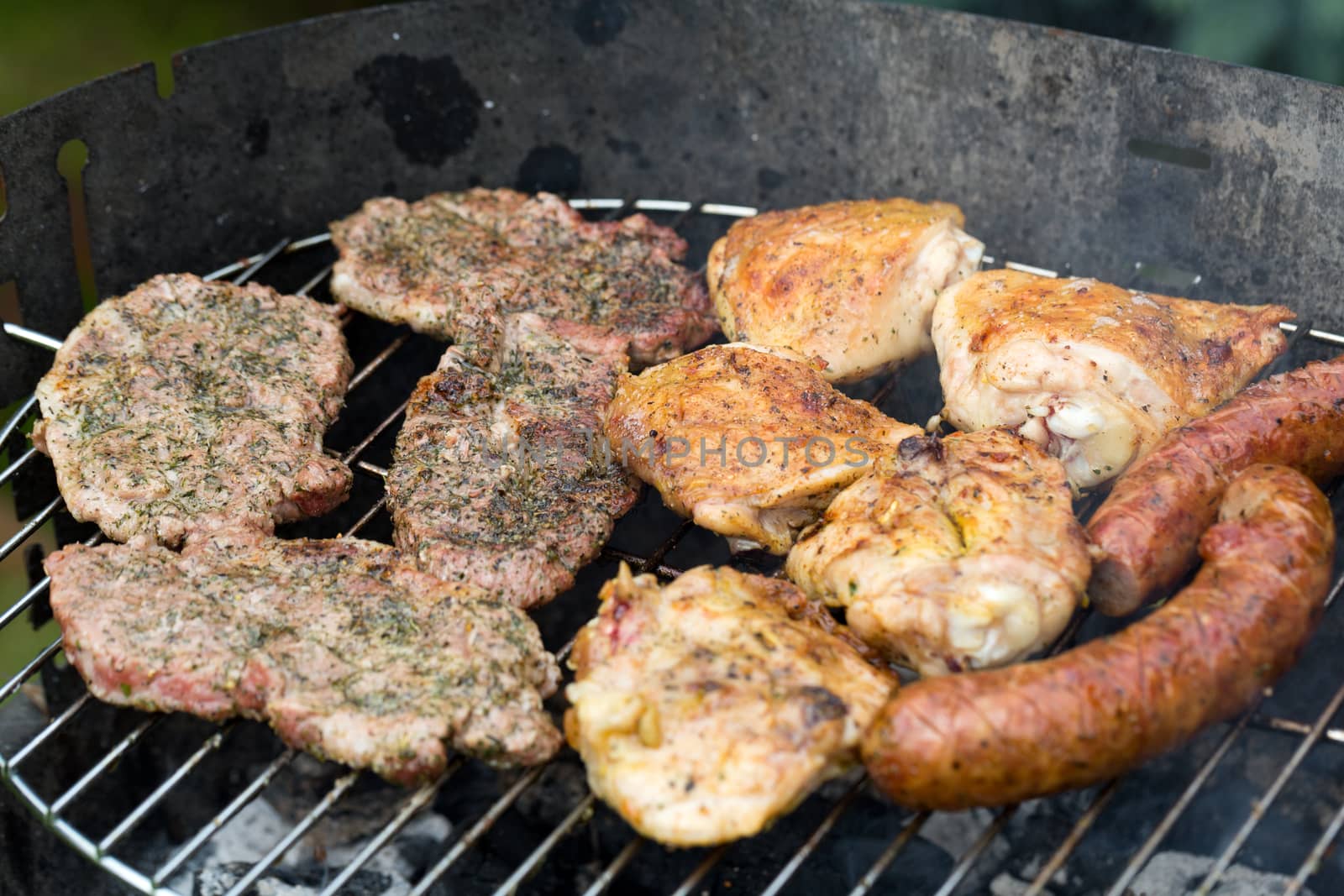 barbecue with delicious grilled meat on grill 