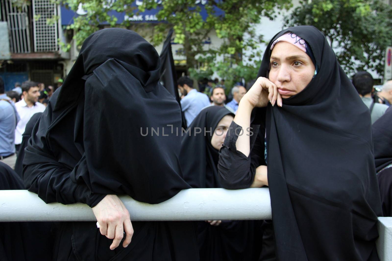 IRAN, Tehran: Family and friends gather at the Behesht-e Zahra cemetery on October 4, 2015 to say their final farewells to loved ones lost in the Mena tragedy. A total of 465 Iranian pilgrims lost their lives in the large stampede of people at the Hajj rituals on September 24, 2015. The pilgrims were on their way to participate in the symbolic stoning of the Satan in the Mena neighbourhood of Mecca, Saudi Arabia. 
