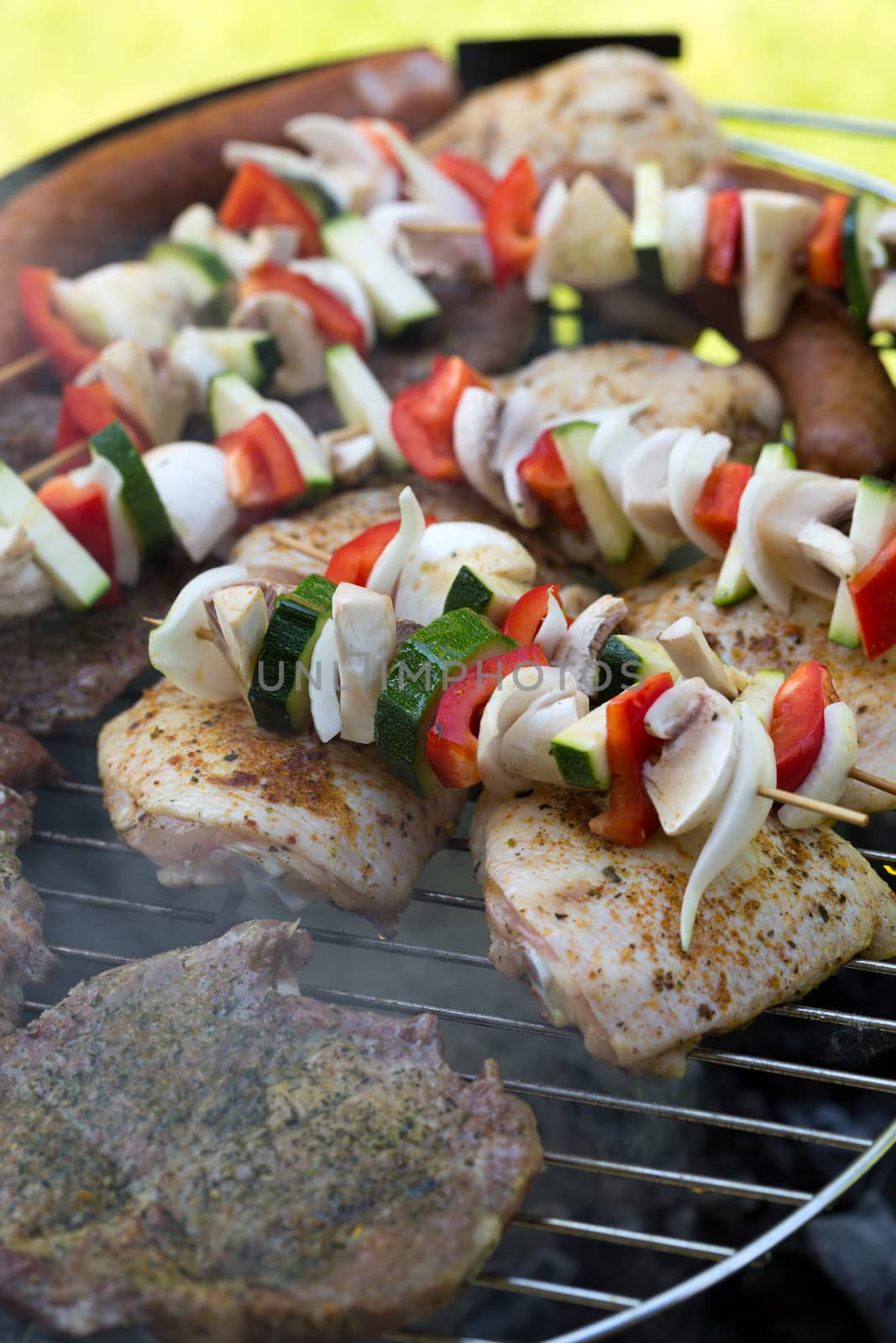 barbecue with delicious grilled meat and vegetables on grill 