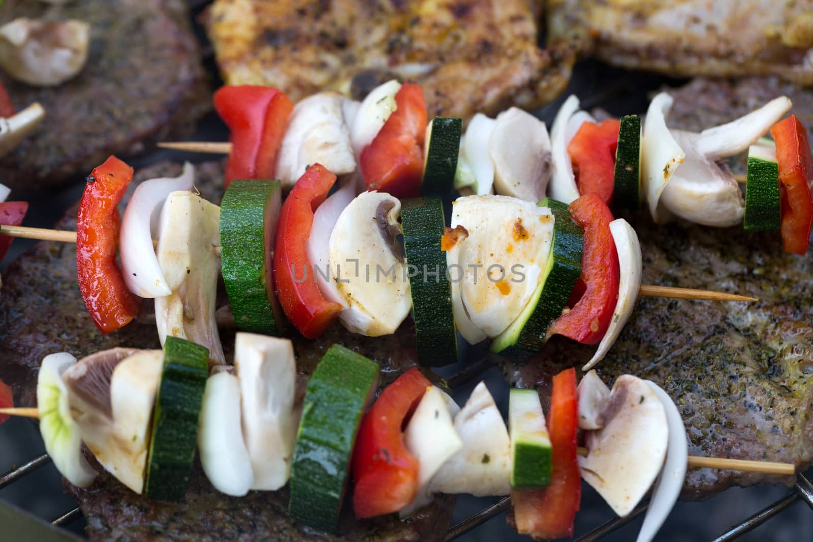 barbecue with delicious grilled meat and vegetables on grill 