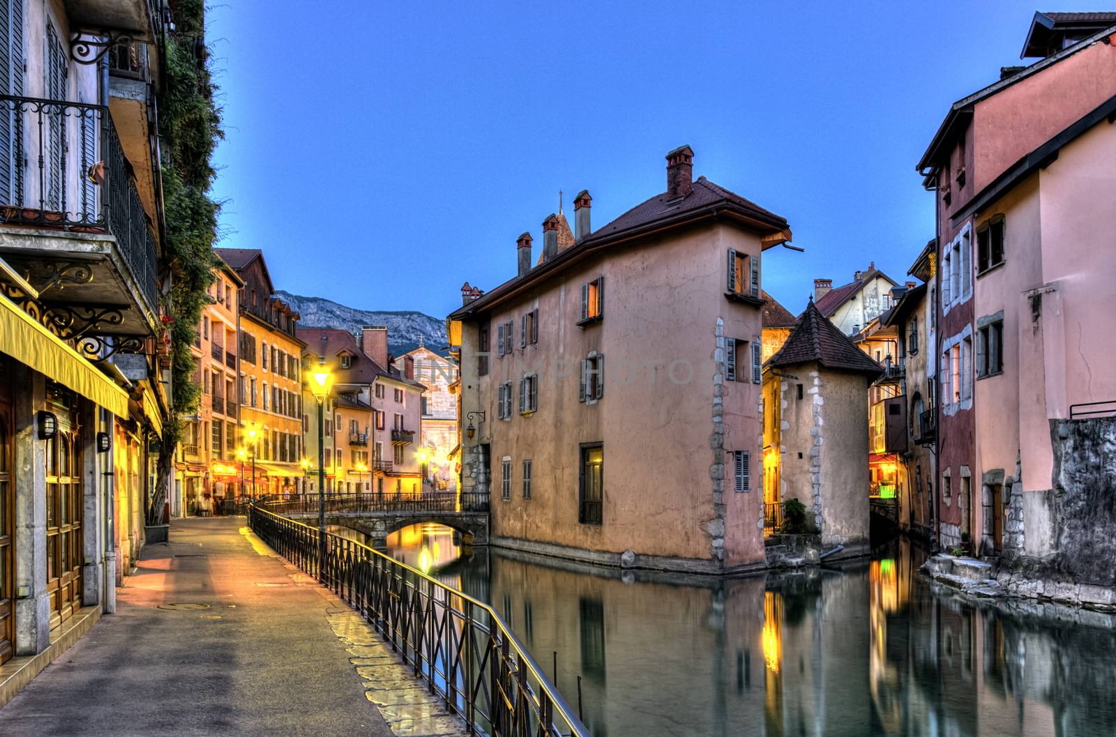 Palais de l'Ile jail and canal in Annecy old city by night, France, HDR