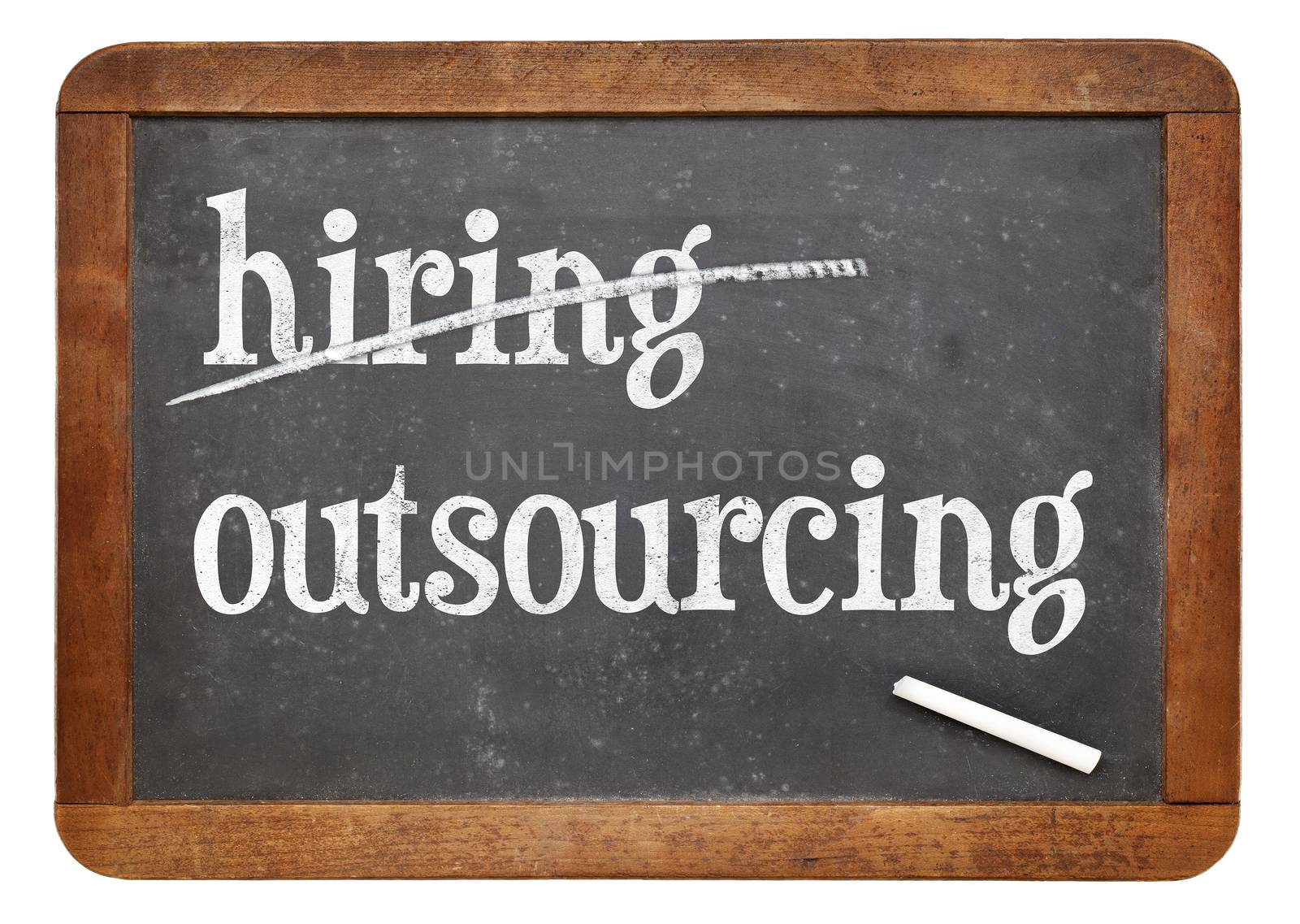 outsourcing instead of hiring concept - white chalk text on a vintage slate blackboard