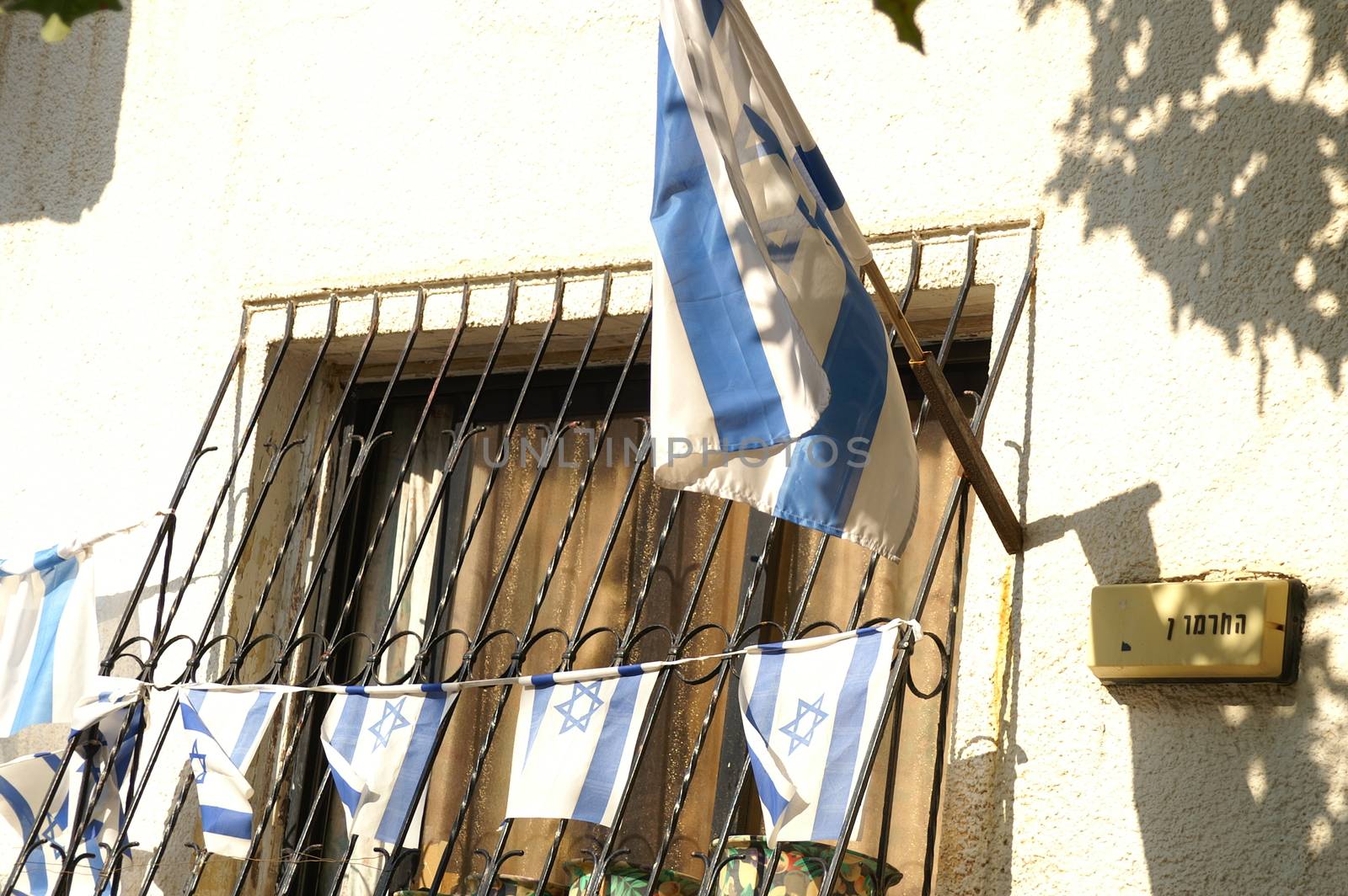 Israeli flags on a house window