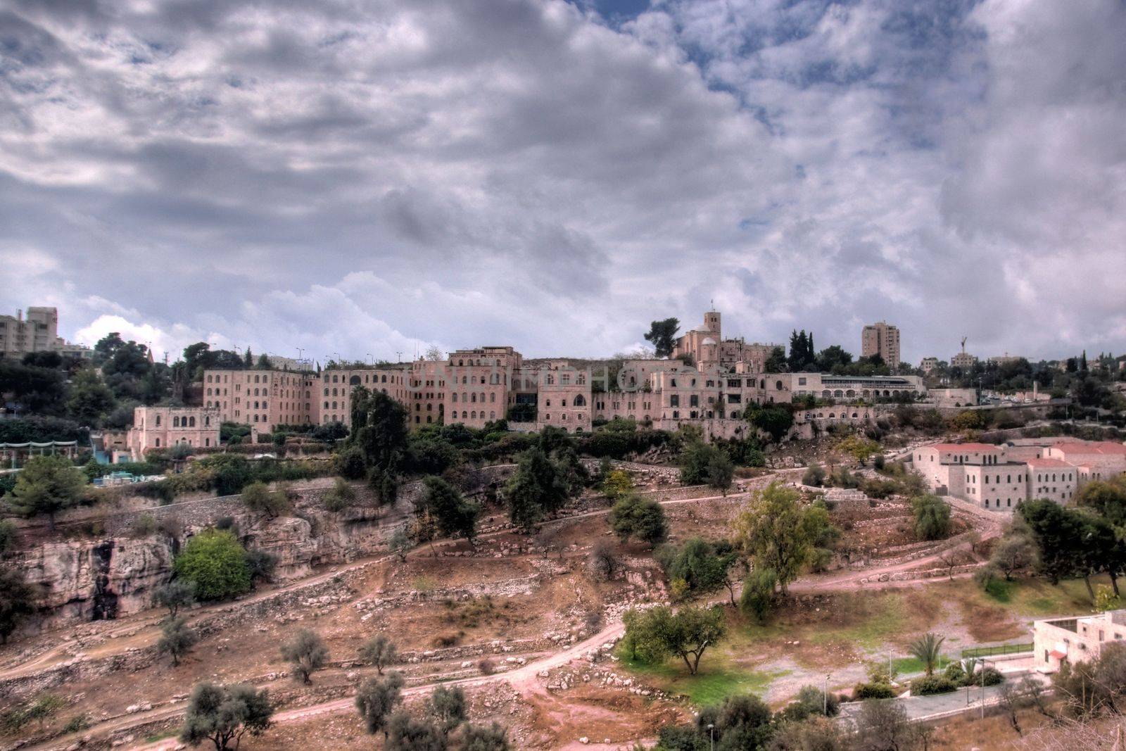 old hotels in jerusalem with dramatic sky in city of peace and war