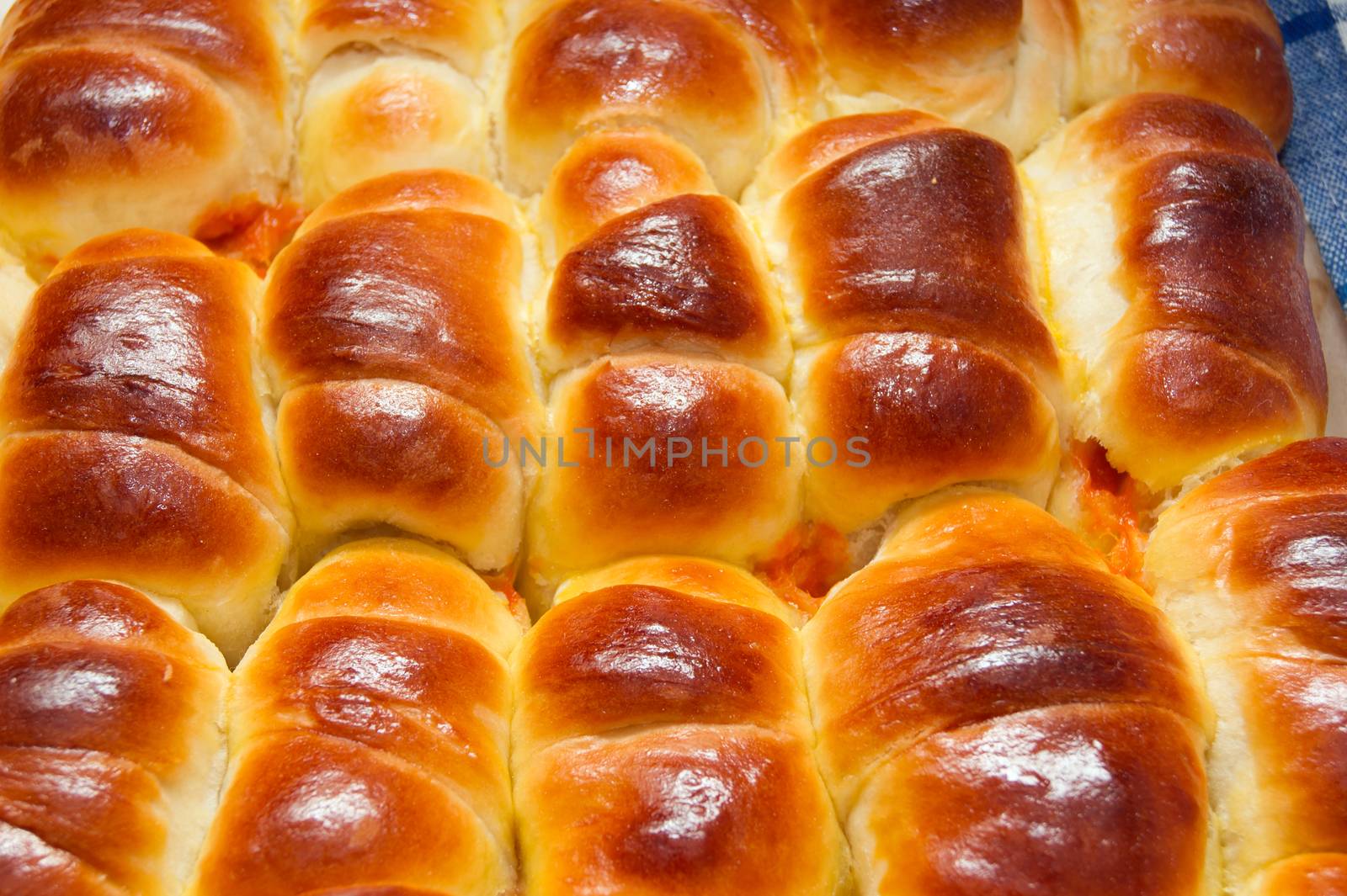 A tasty croissant with jam made from rose hip jam.