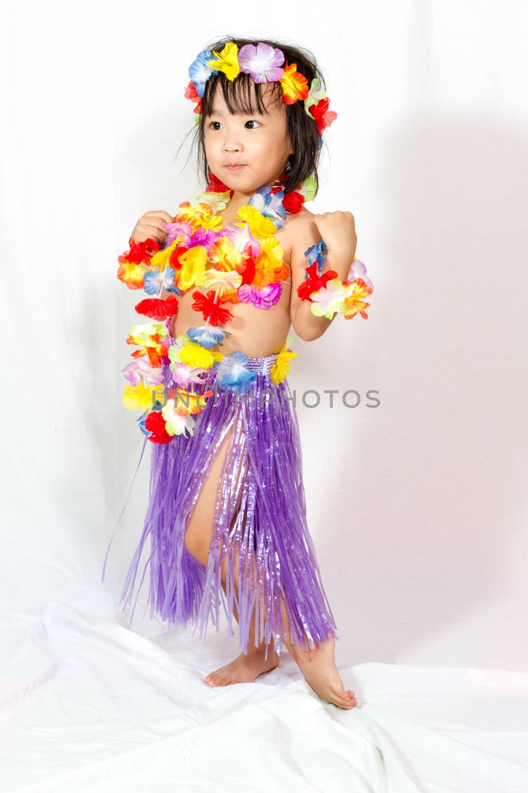 Asian Chinese little girl in hawaiian costume