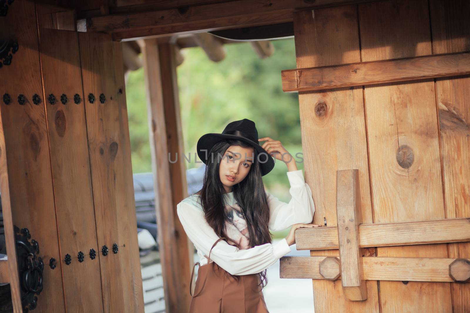 Beautiful girl standing and poses in vintage suit by nopparats