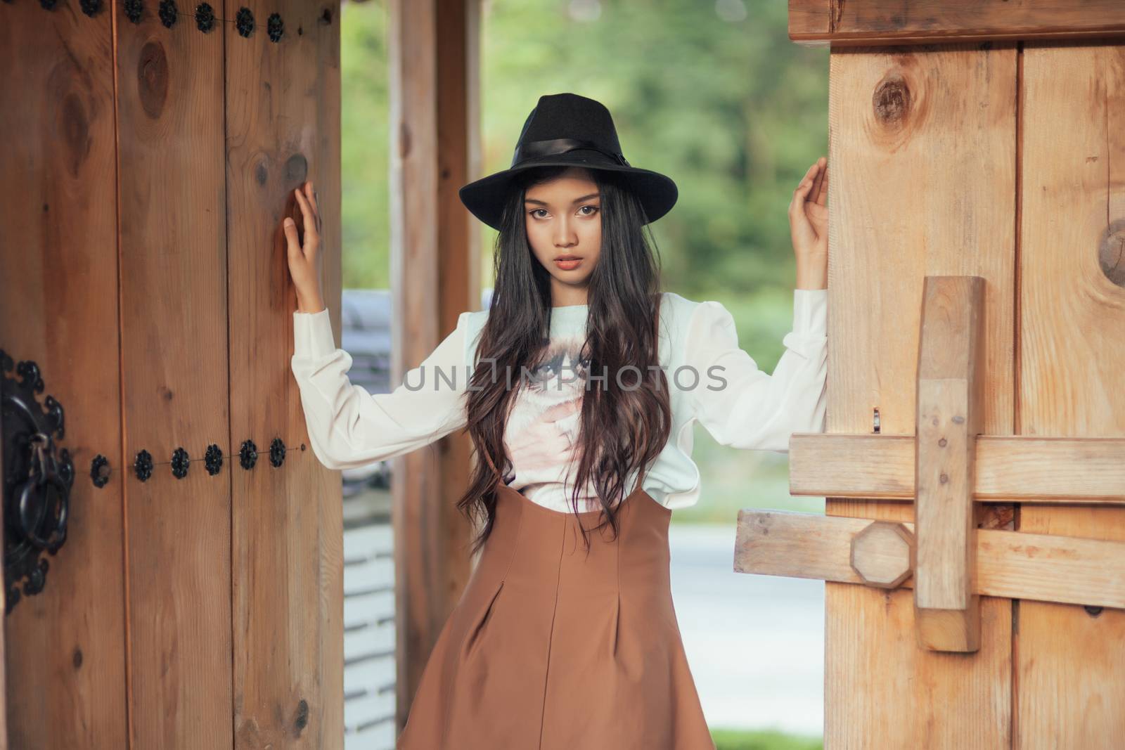 Beautiful girl standing and poses in vintage suit .