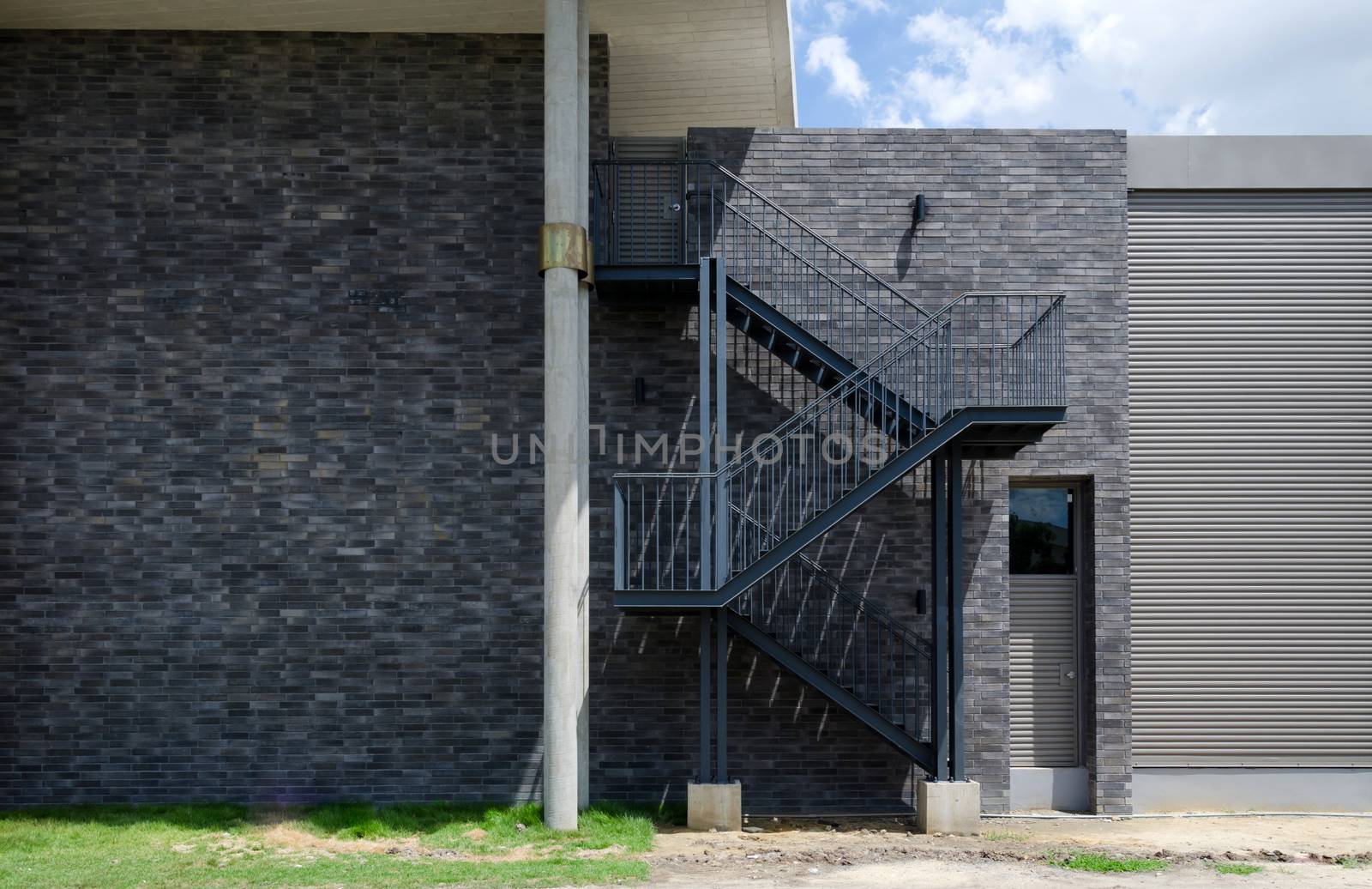 Fire escape staircase on the external wall  by siraanamwong