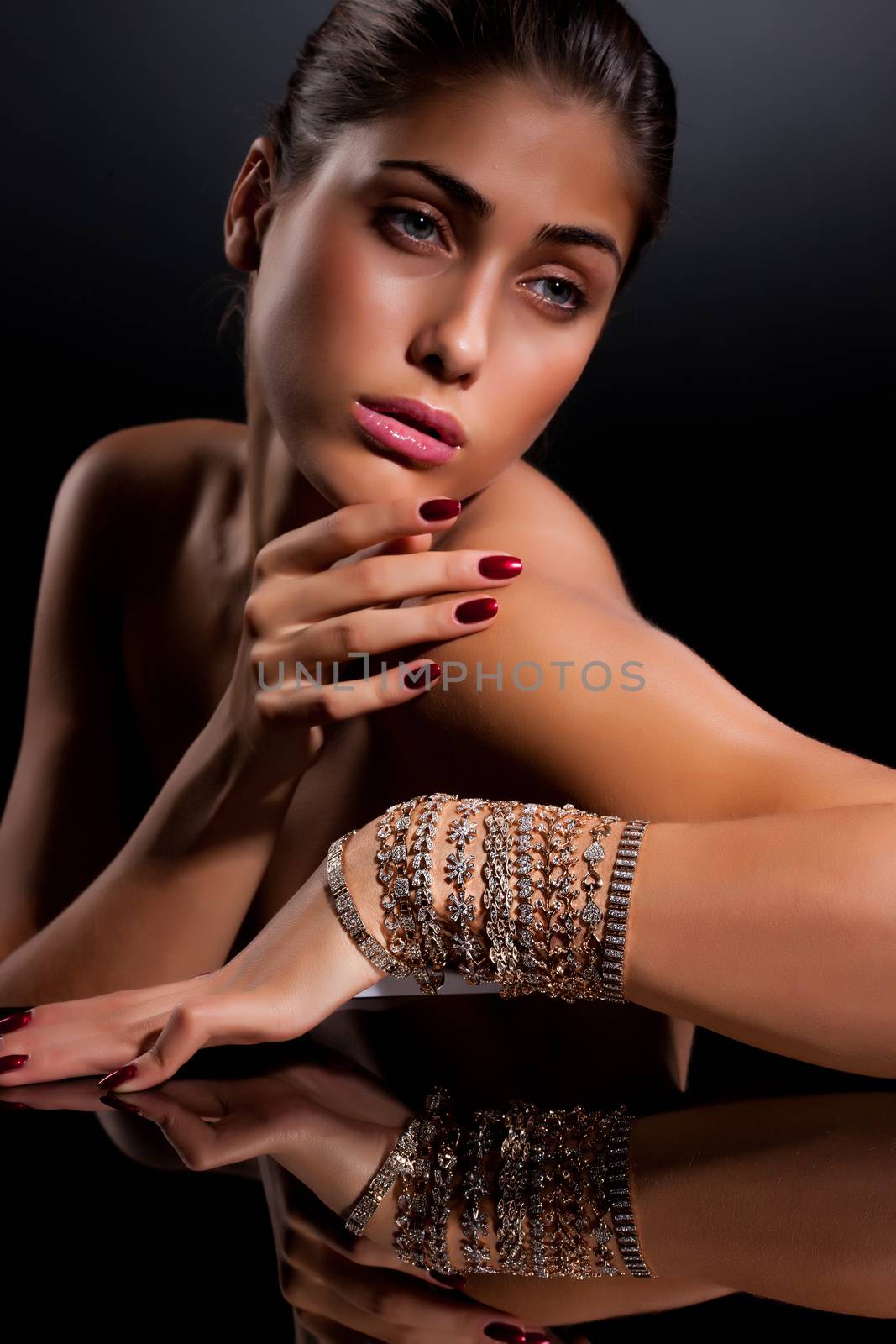 Young beautiful woman with bracelets on her hand