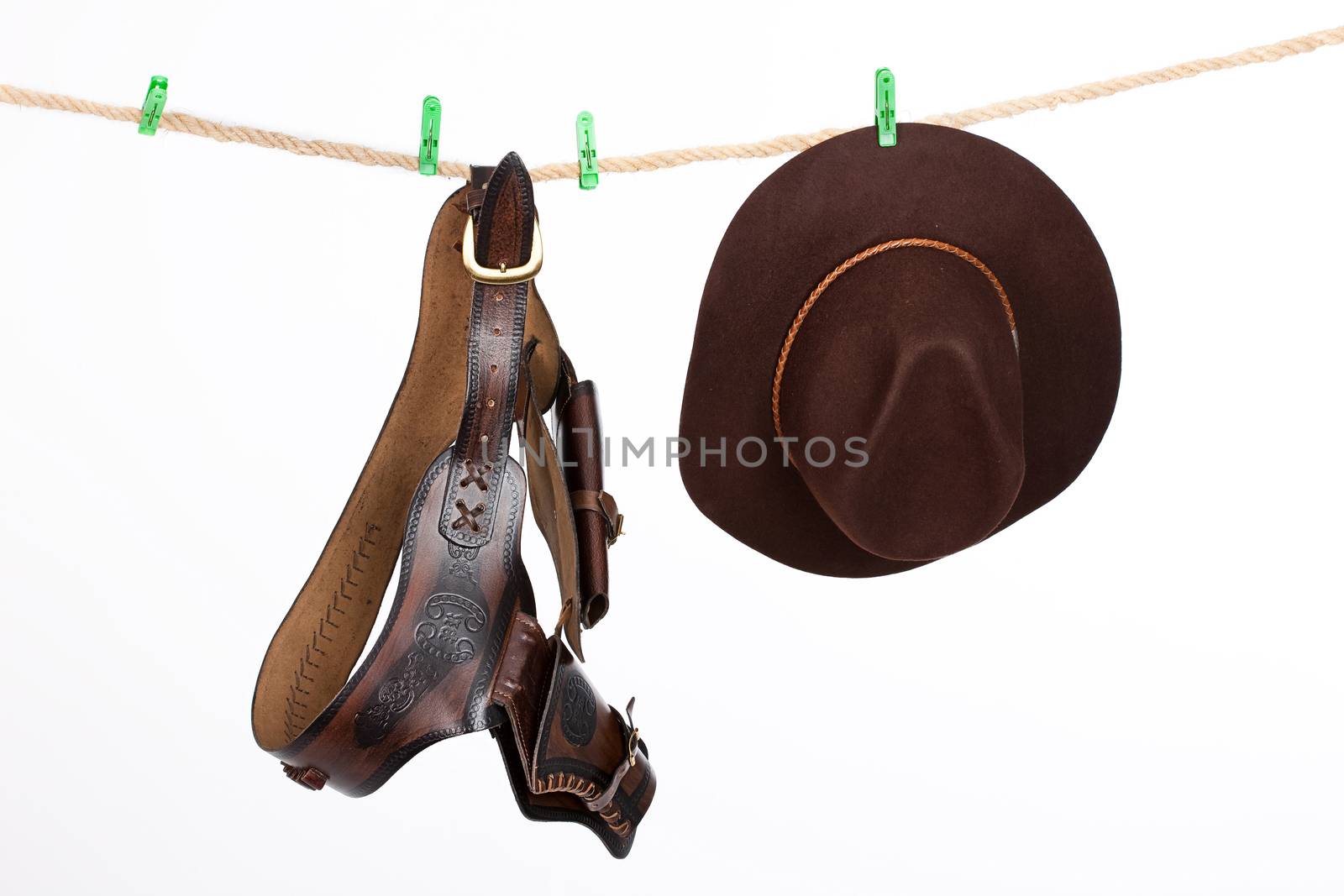 Cowboy Hat and Belt On A Clothesline by Fotoskat