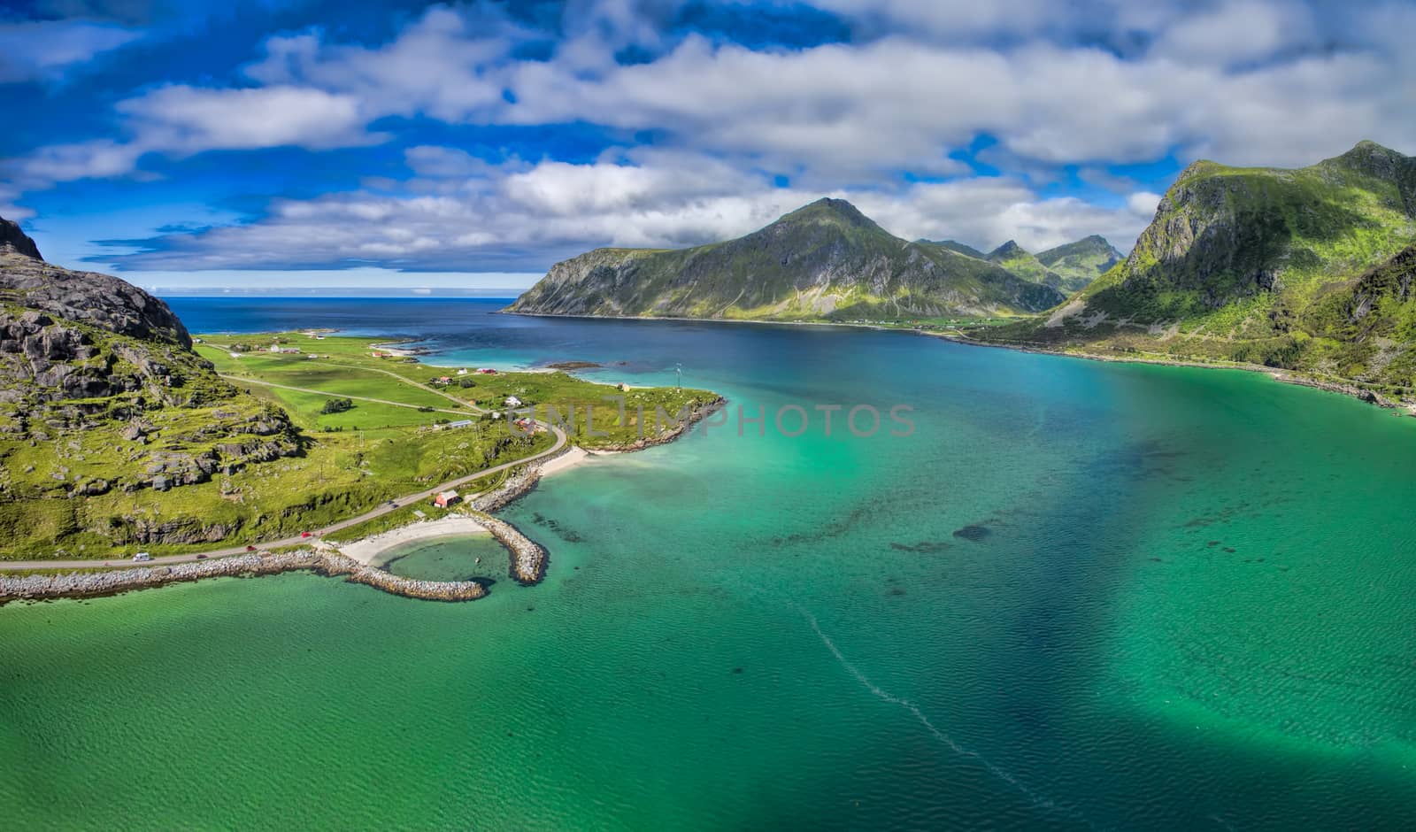 Tranquil fjord with small harbor on Lofoten islands in Norway, aerial view